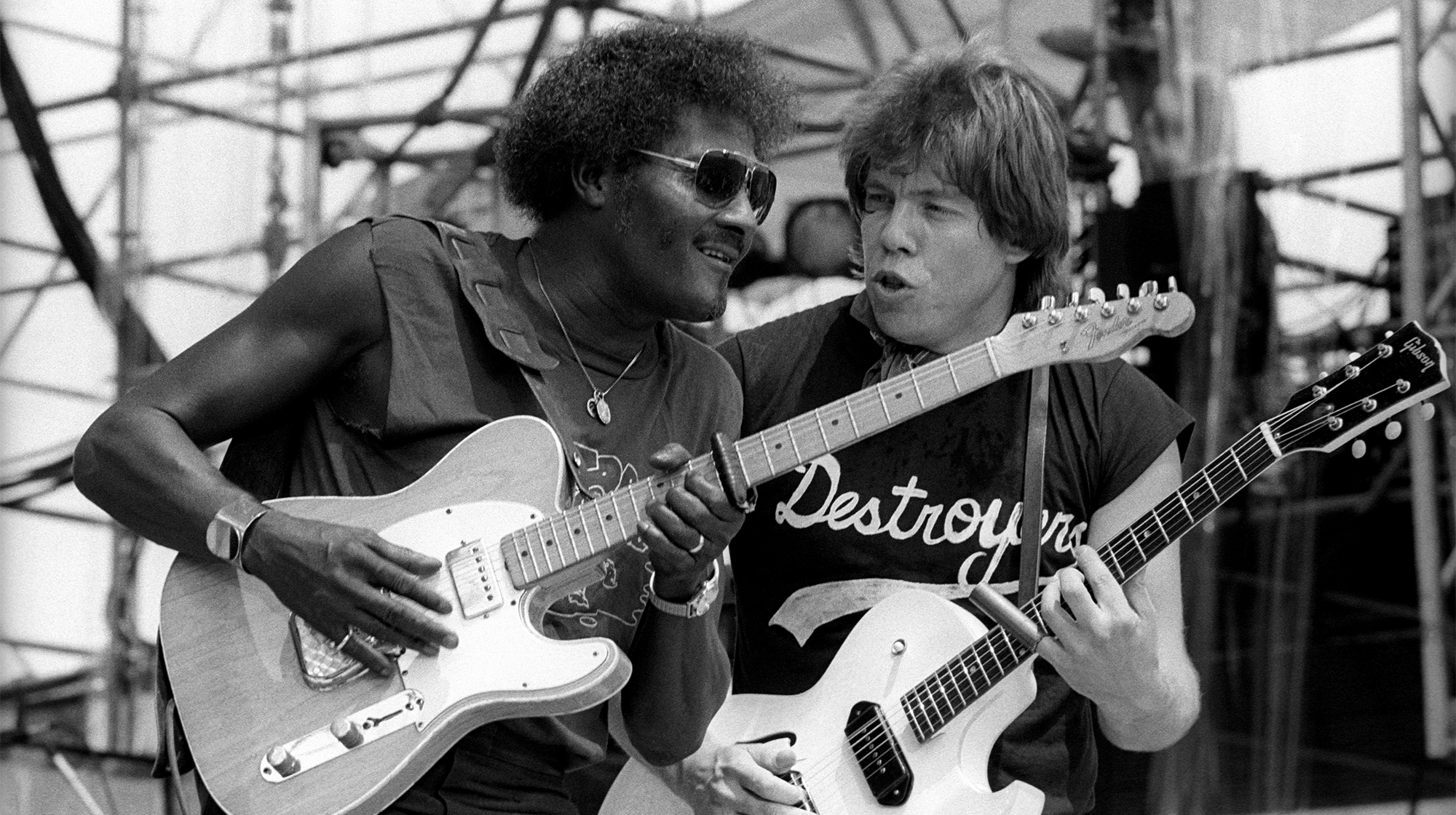 Albert Collins and George Thorogood performing on stage at Live Aid at the JFK Stadium