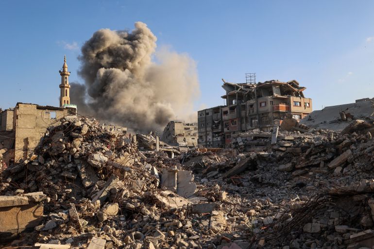 Smoke billows following an Israeli strike that targeted a building in the Bureij camp for Palestinian refugees in the central Gaza Strip on October 19, 2025. Gaza's civil defence agency said a series of Israeli air strikes on October 19 killed at least 11 people across the territory, as Israel and Hamas traded blame for violating a ceasefire. (Photo by Eyad BABA / AFP)