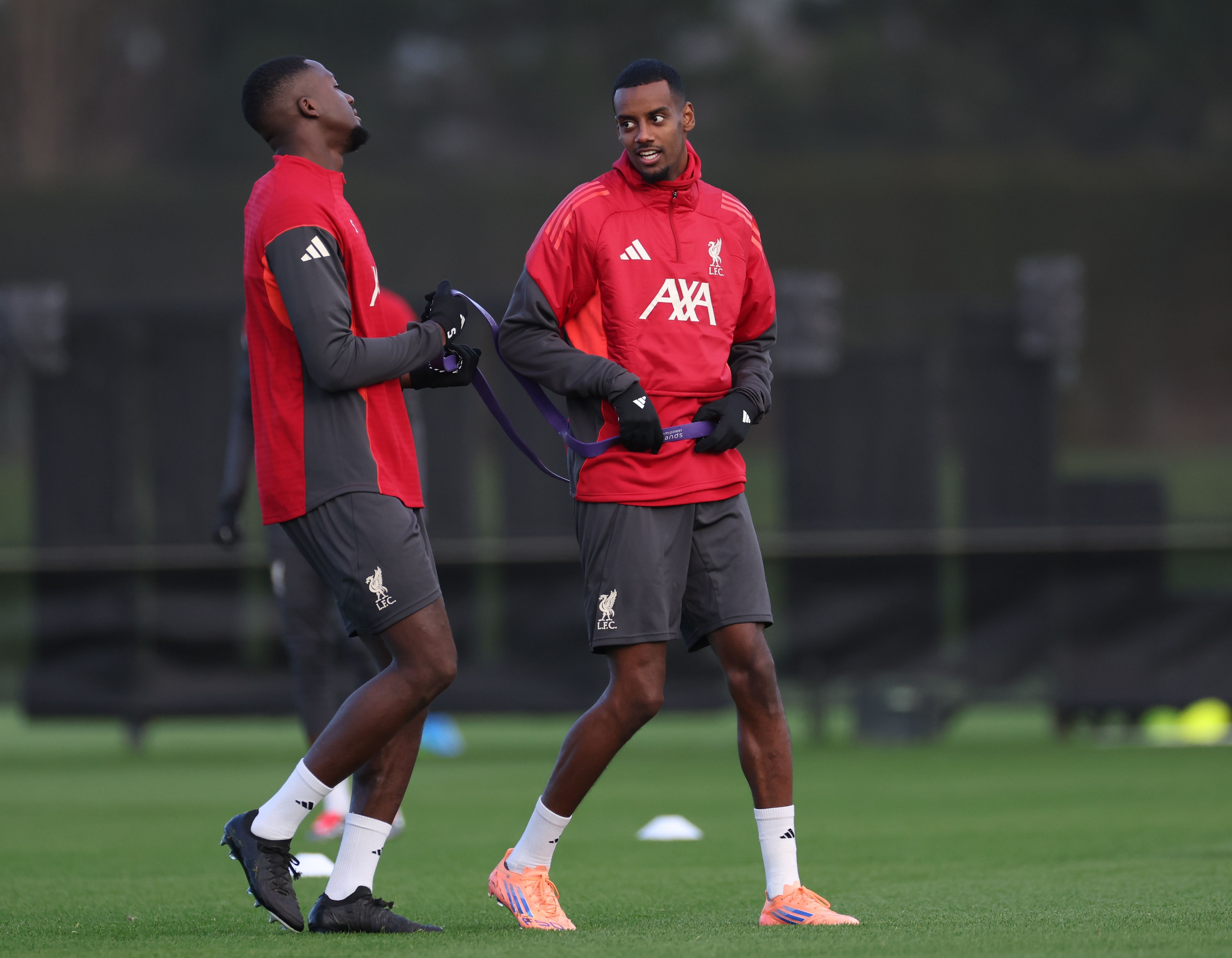 Alexander Isak speaks with Ibrahima Konate at the AXA Training Centre.
