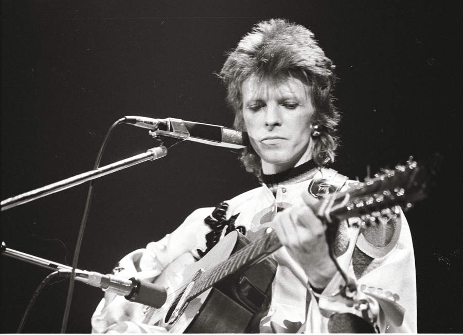 Musician David Bowie performs onstage during his "Ziggy Stardust" era in 1973 in Los Angeles, California
