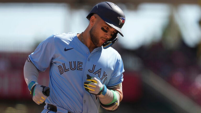 Toronto Blue Jays' Bo Bichette rounds third base after hitting a two-run home run in the ninth inning of a baseball game against the Cincinnati Reds, Monday, Sept. 1, 2025, in Cincinnati.
