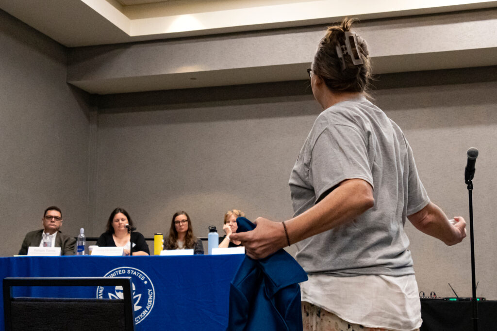 A protestor confronts EPA officials at a public hearing on coal ash in Montgomery, Ala. Credit: Lee Hedgepeth/Inside Climate News
