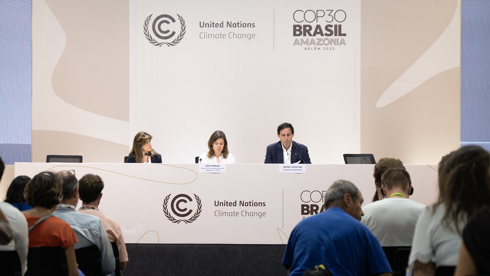 Diplomats discuss climate policy at COP30 in Brazil.