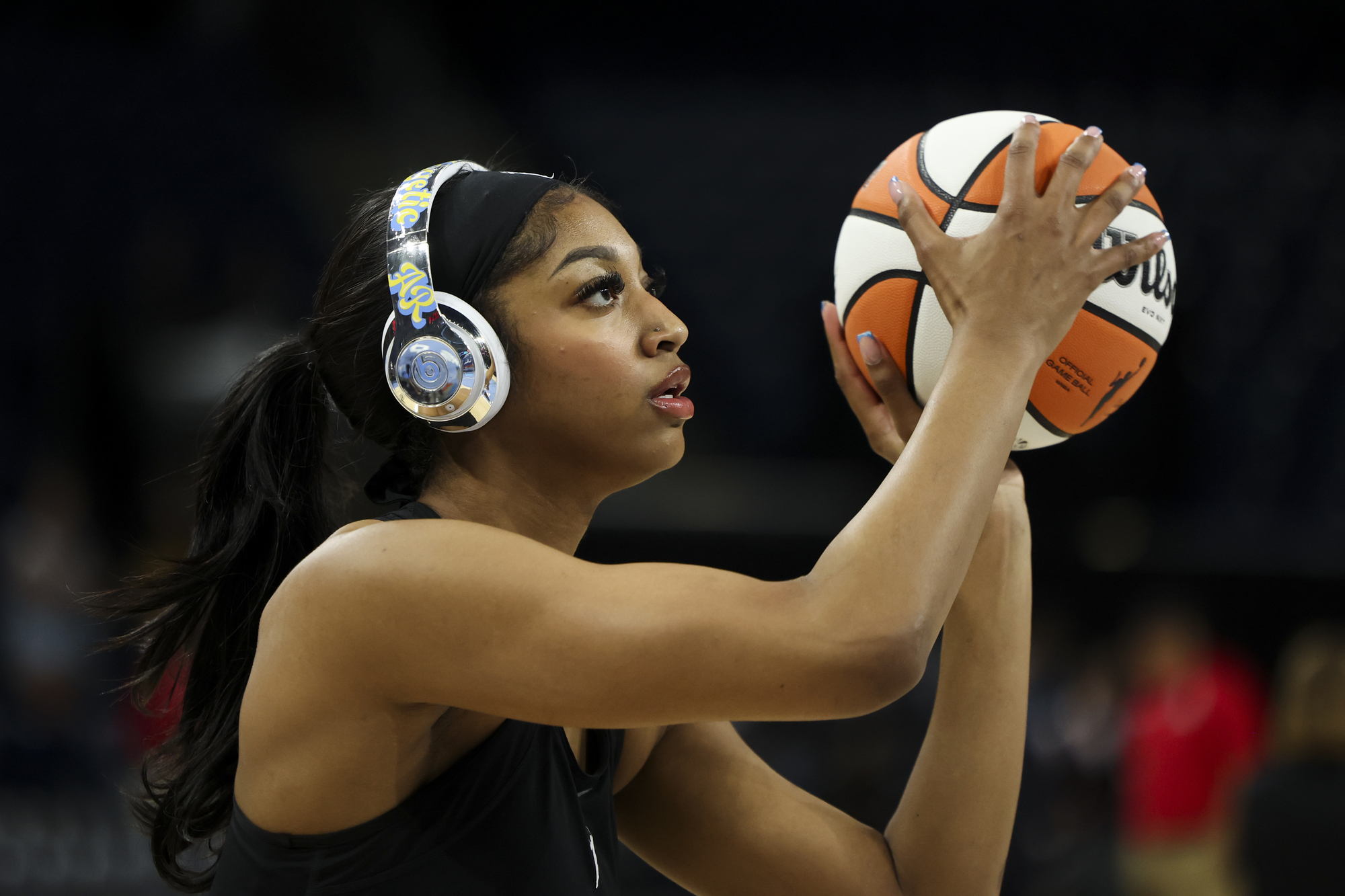 Sky forward Angel Reese warms up before a game against...