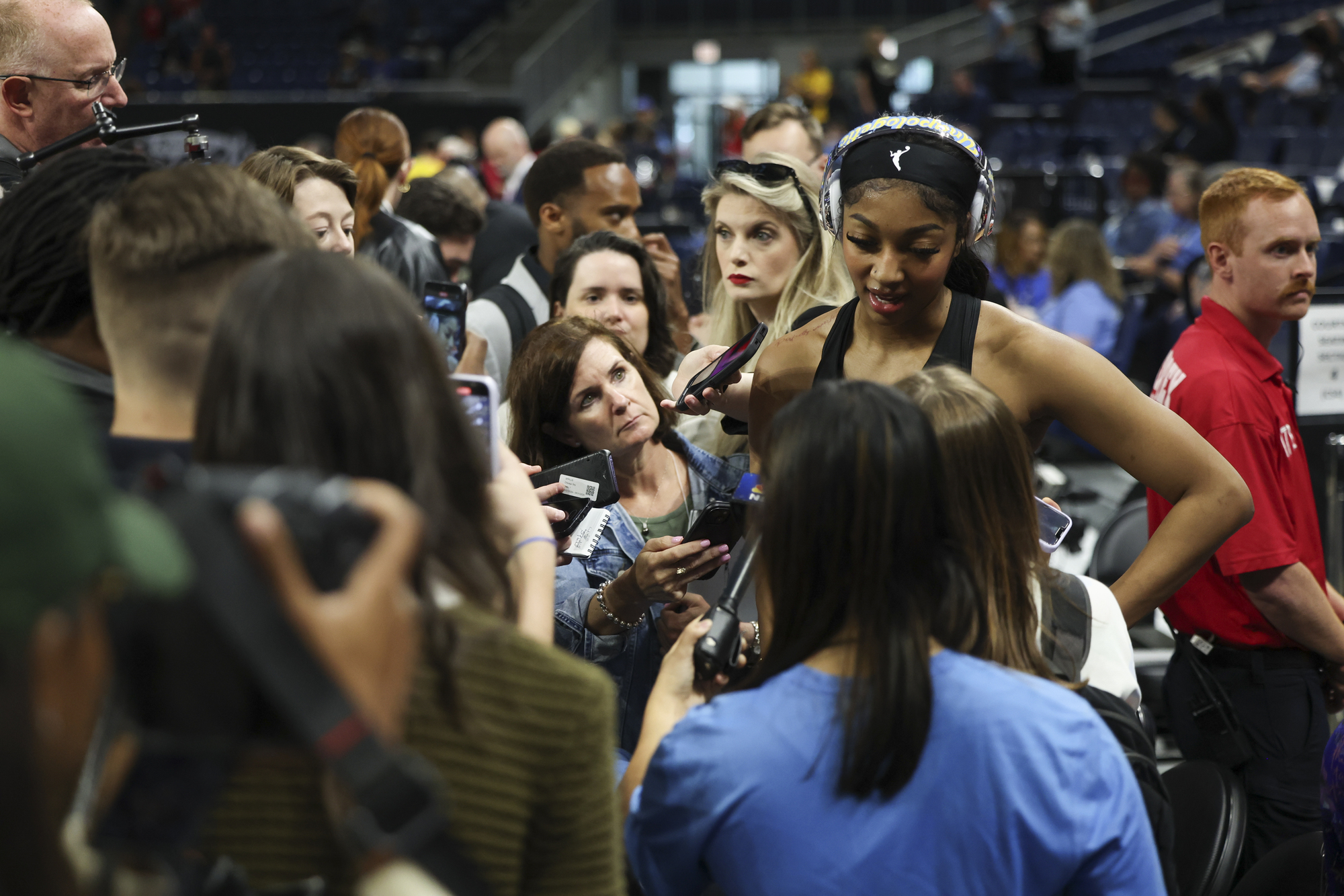 Chicago Sky forward Angel Reese answers questions before the game...