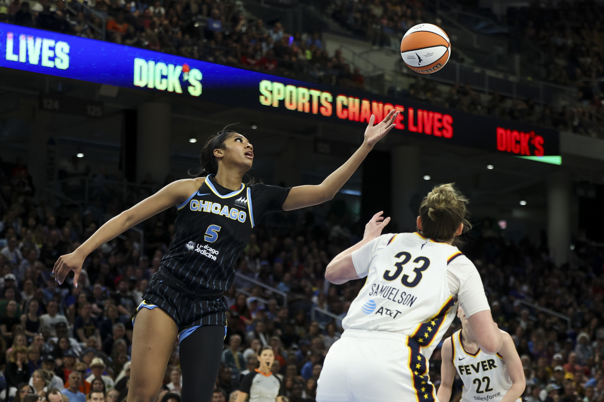 Chicago Sky forward Angel Reese (5) reaches for a loose...