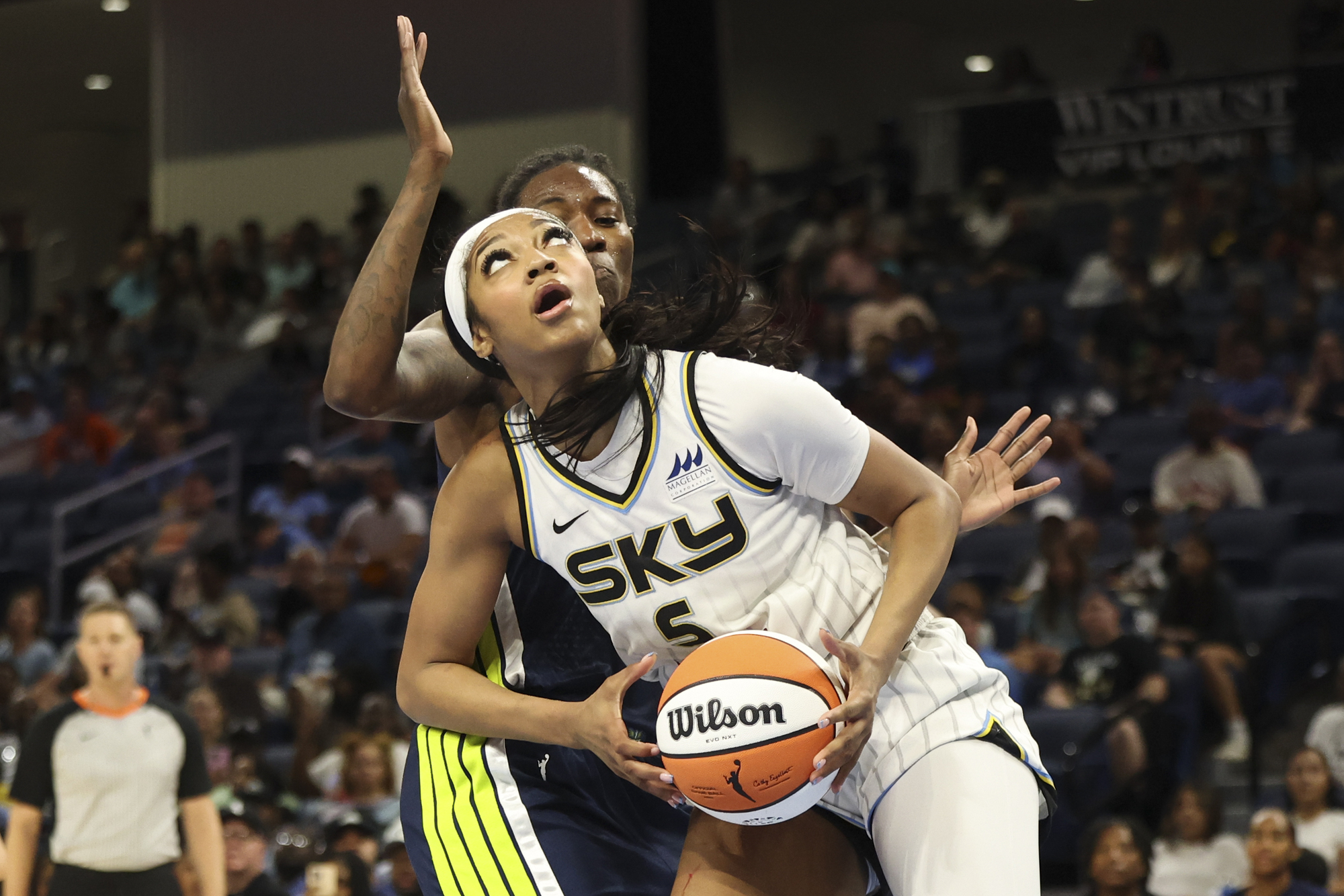 Chicago Sky forward Angel Reese (5) tries to get past...