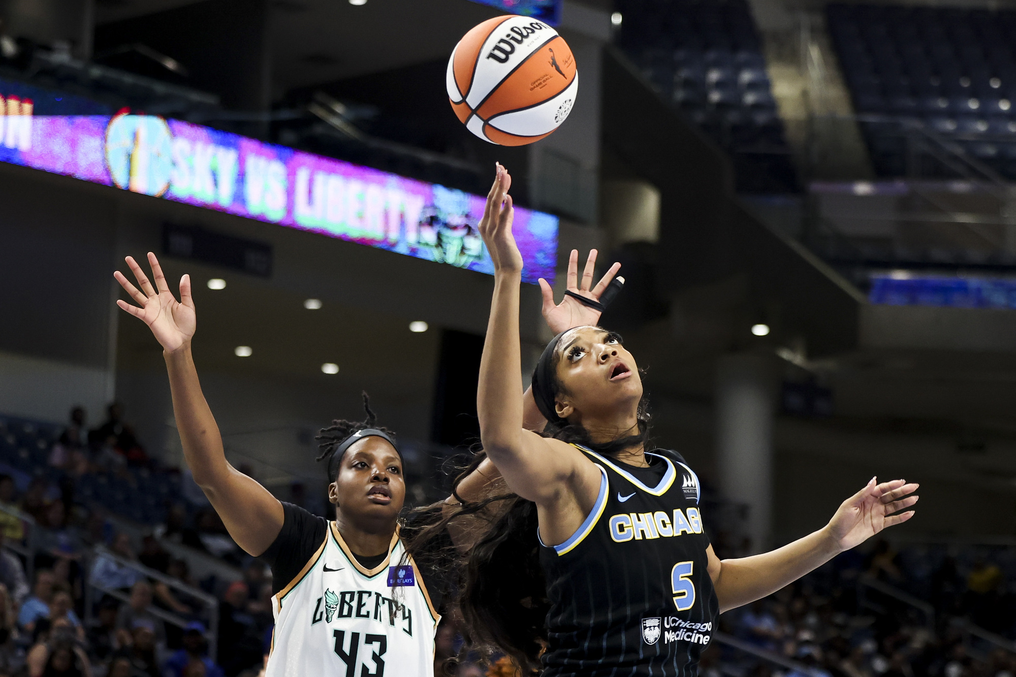 Chicago Sky forward Angel Reese (5) battles New York Liberty...