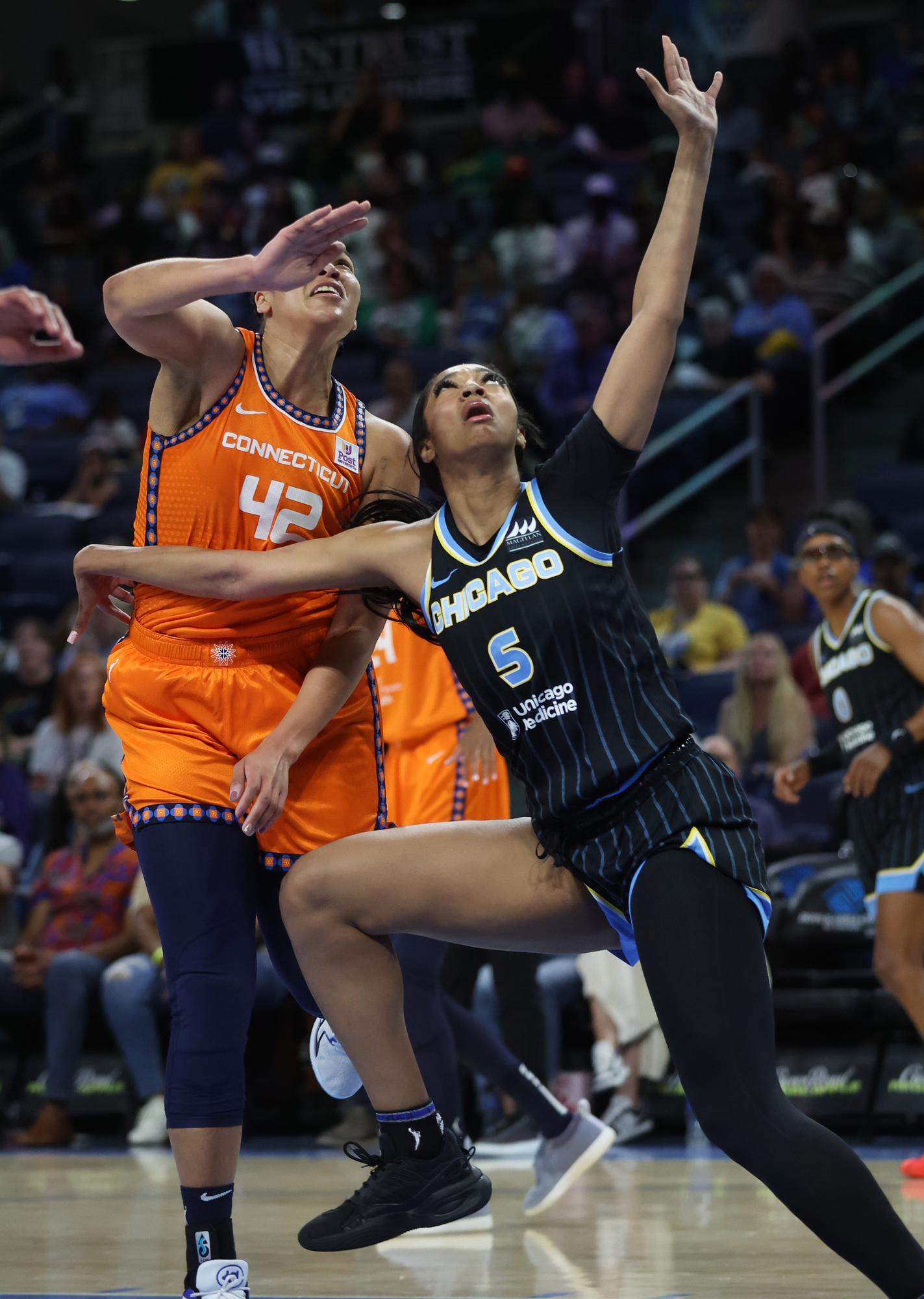 Chicago Sky forward Angel Reese looks for position while battling...