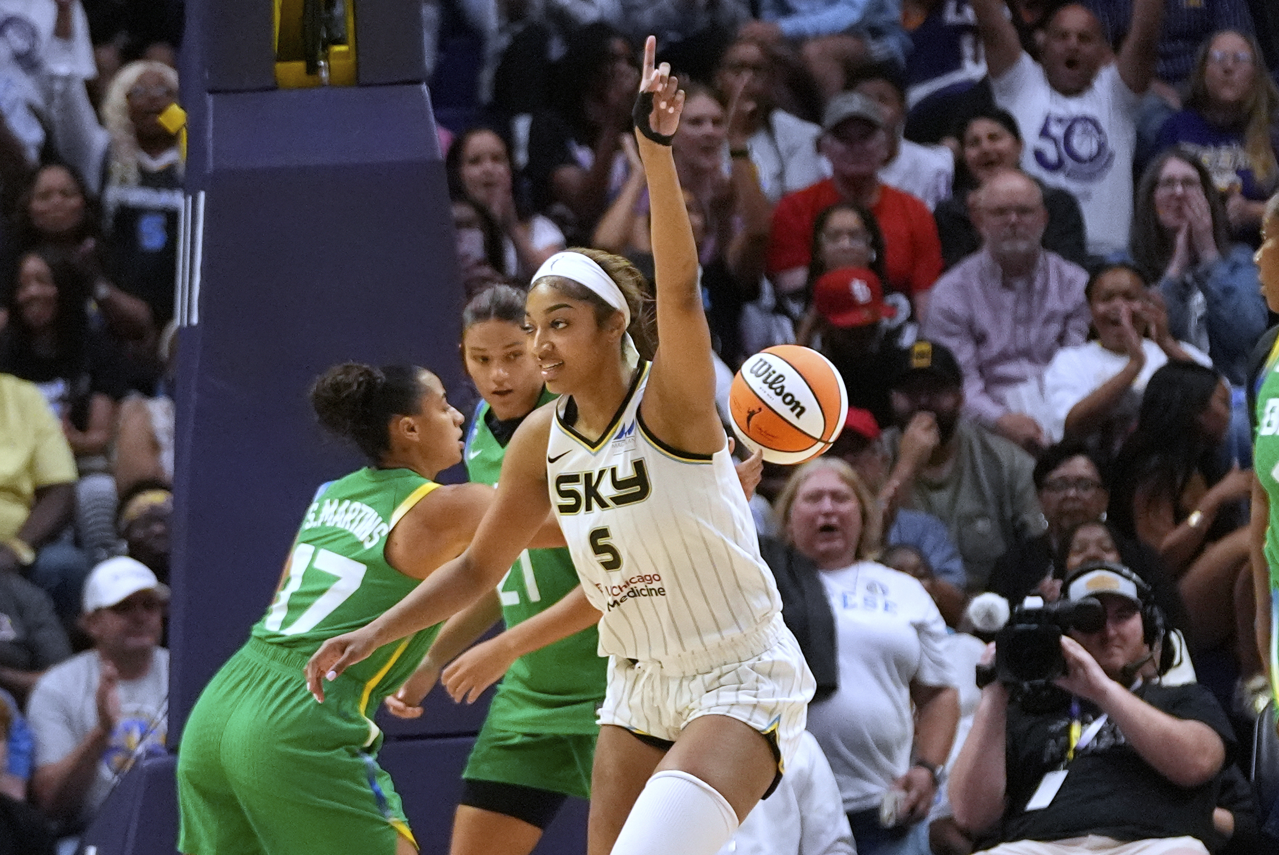Sky forward Angel Reese (5) reacts after making a basket...