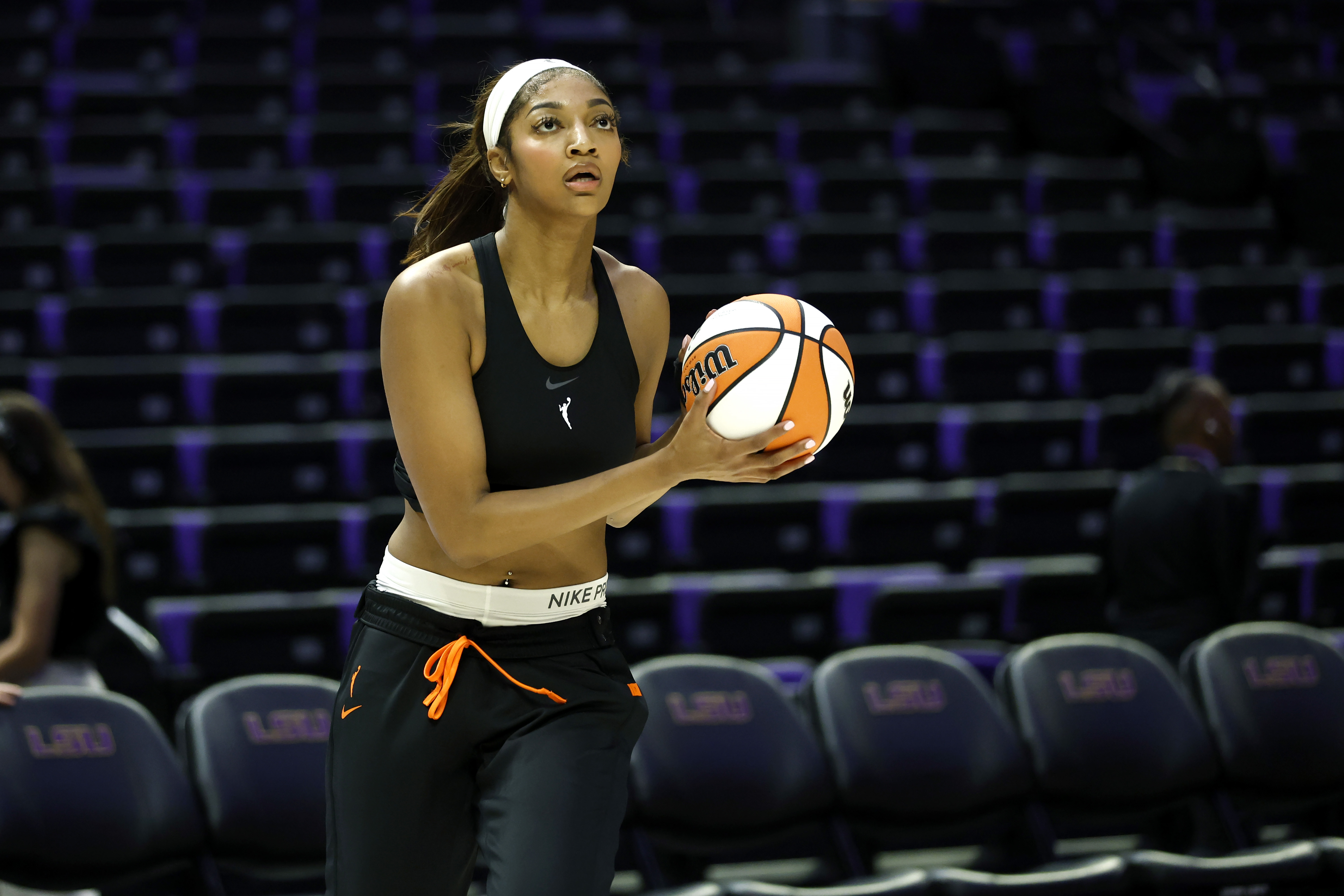 The Sky's Angel Reese warms before a preseason game against...