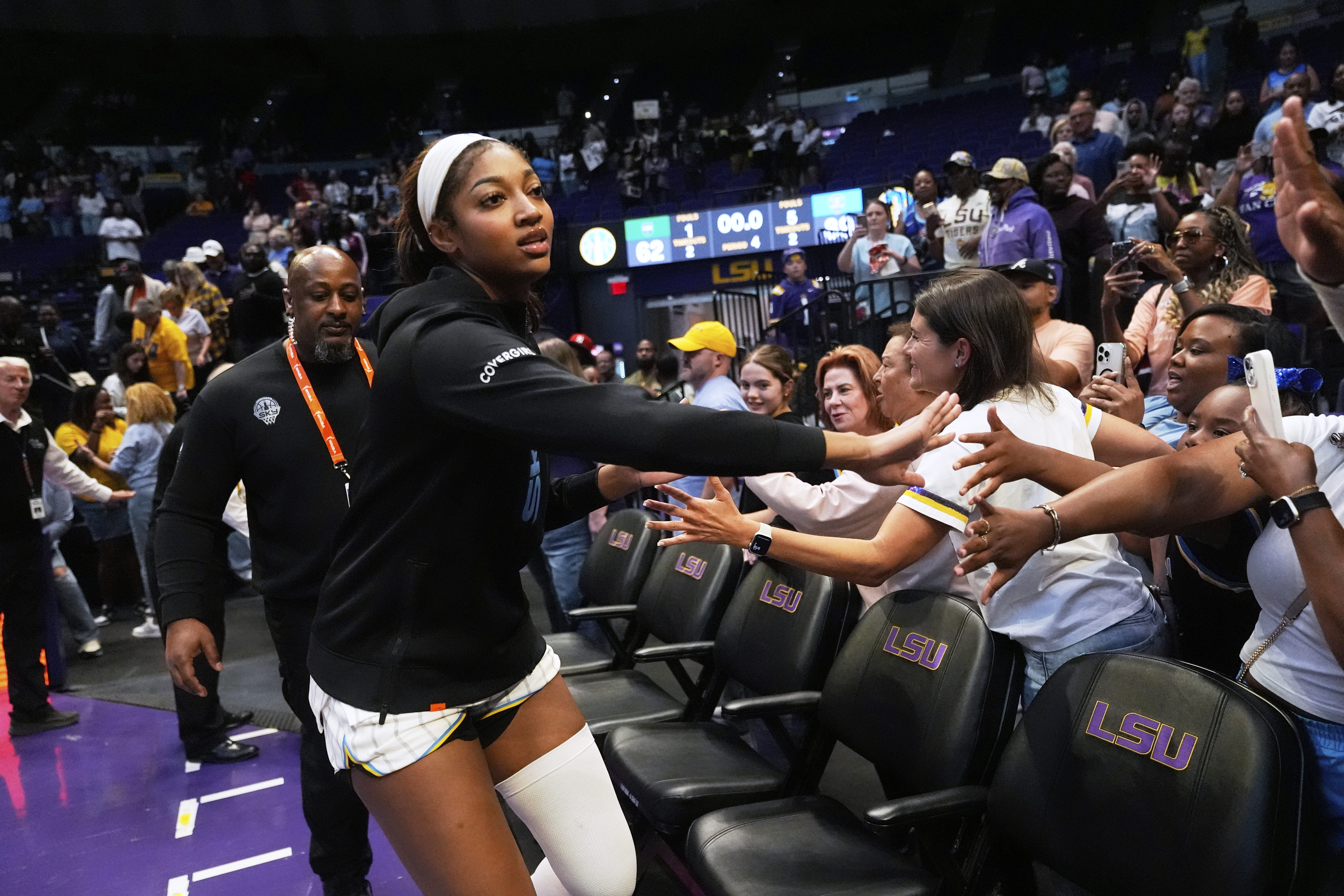 Sky forward Angel Reese greets the crowd after an exhibition...