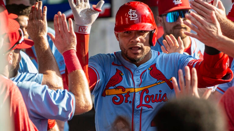 St. Louis Cardinals' Willson Contreras is congratulated by his teammates after hitting a solo home run off Cleveland Guardians relief pitcher Kolby Allard during the ninth inning of a baseball game, Saturday, June 28, 2025, in Cleveland.