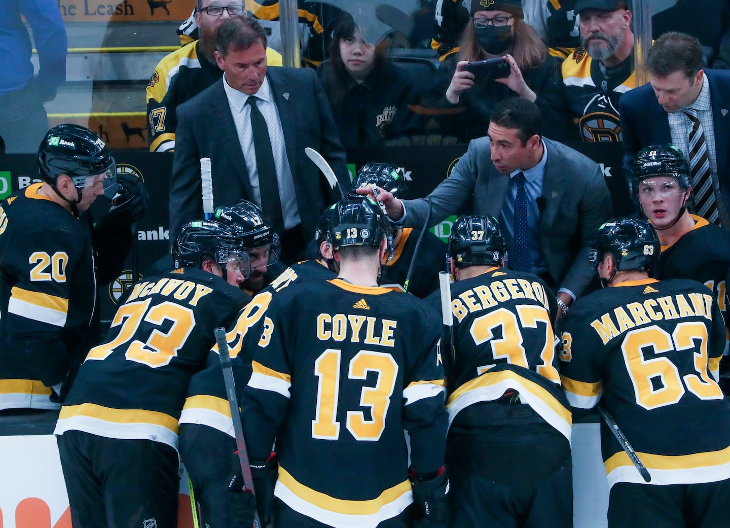 Bruins assistant coach Chris Kelly says he has picked up something from every coach he's worked for, like former Boston coach Bruce Cassidy (left, rear) and last year's interim coach, Joe Sacco (right, rear). Back in March 2022, Cassidy let Kelly handle the discussion during a time out against the Kings at the Garden. 