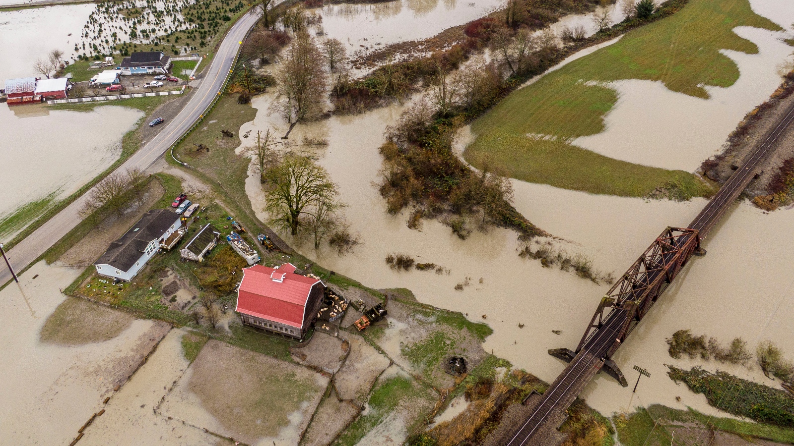 In an aerial view, floodwaters inundate farmland on December 6, 2023 near Silvana, Washington. Atmospheric river conditions in the region brought heavy rains and flooding.