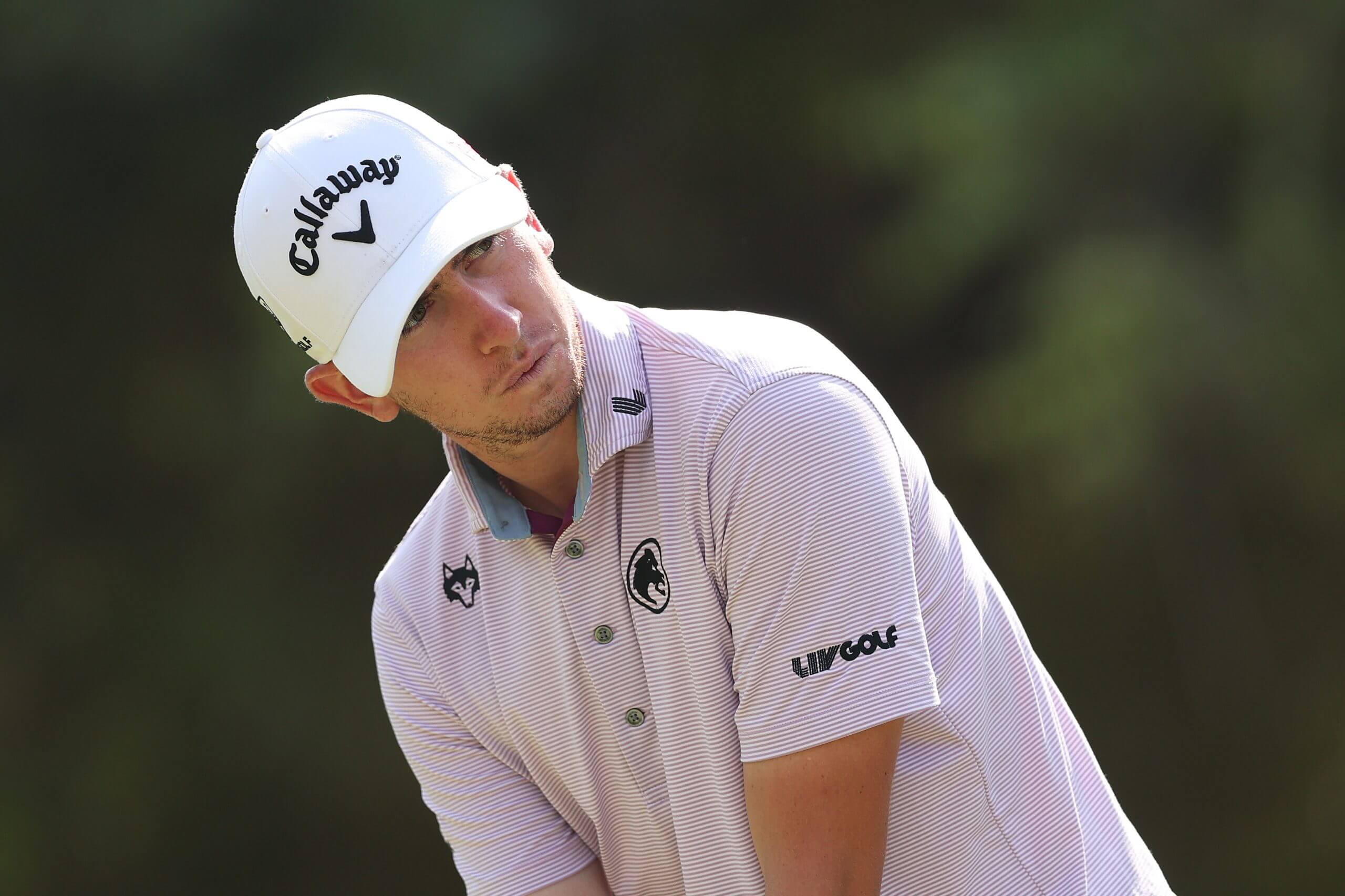 Tom McKibbin looks ahead to his target during a LIV Golf round.
