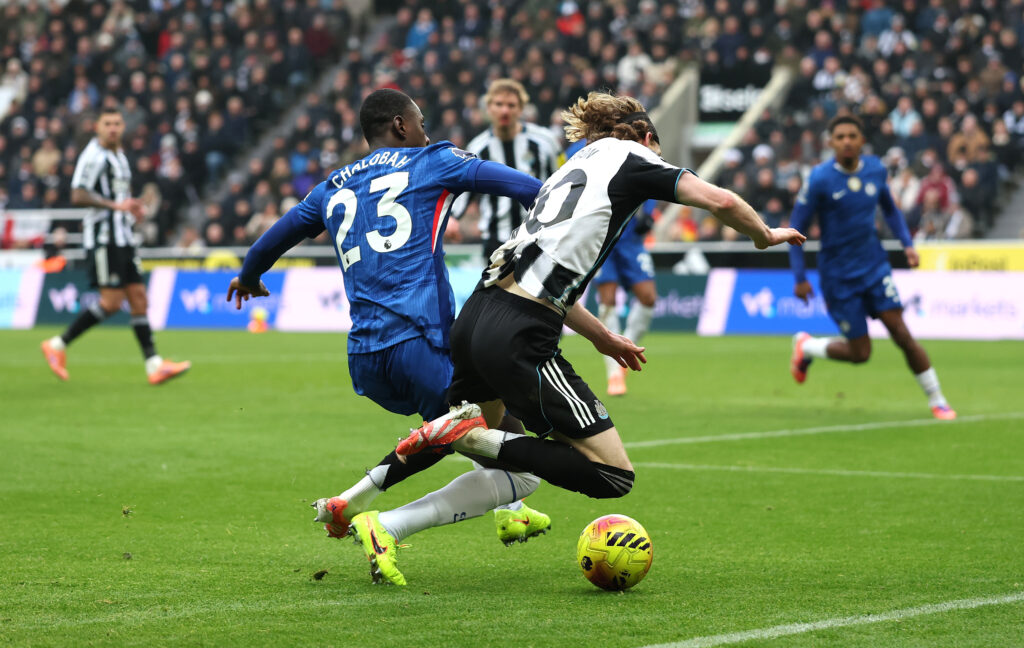 Trevoh Chalobah tackles Anthony Gordon during Newcastle United vs Chelsea.