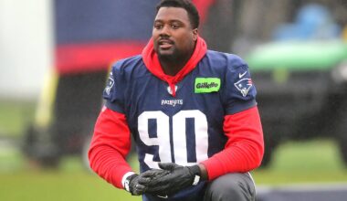 Christian Barmore rests during warmups on the Gillette Stadium practice field in Foxborough on Oct. 29, 2025.