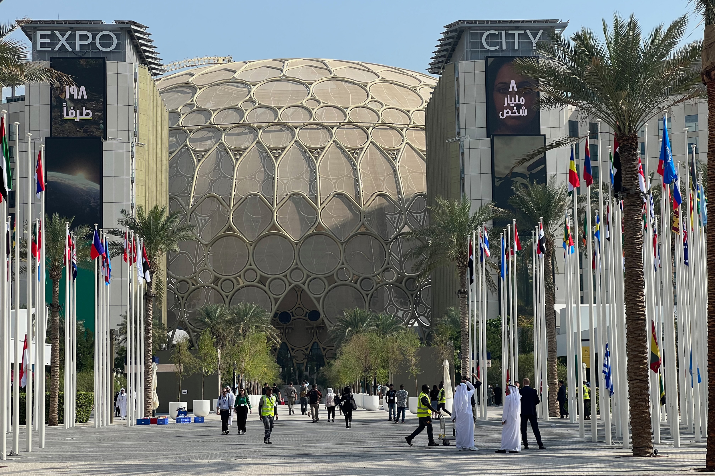 Delegates walk through the Expo City Dubai complex during COP28 in 2023, where the world’s largest climate summit unfolded amid monumental architecture and displays of energy excess.