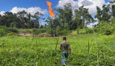 Donald Moncayo, president of the Union of Peoples Affected by Chevron-Texaco, walks toward a gas flare in the Ecuadorian Amazon region. Credit: Katie Surma/Inside Climate News