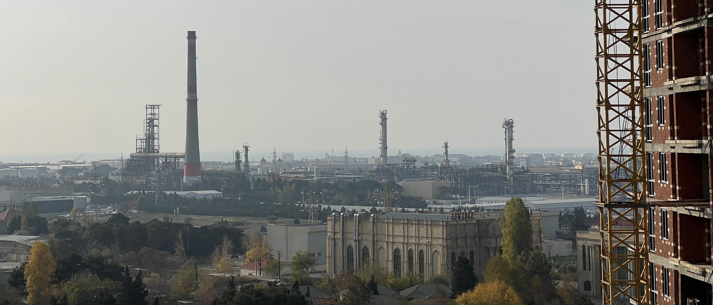 During COP29, Baku’s fossil fuel infrastructure filled the horizon outside the conference venue. Once a cradle of the oil age, the city embodies the persistent global reliance on the energy system the climate talks are struggling to dismantle.