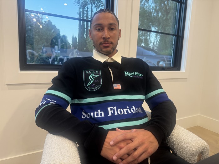 Ben Simmons sitting in a chair