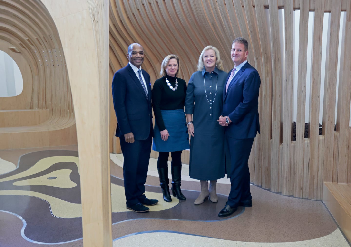 From left, Boston Children's Hospital president and CEO Dr. Kevin Churchwell, Dr. Stacy Drury, psychiatrist in chief, Karen Hale and Rob Hale posed in the Friendship Garden at the hospital. The $100 million gift from the Hales is the largest donation the couple has made to a single entity.