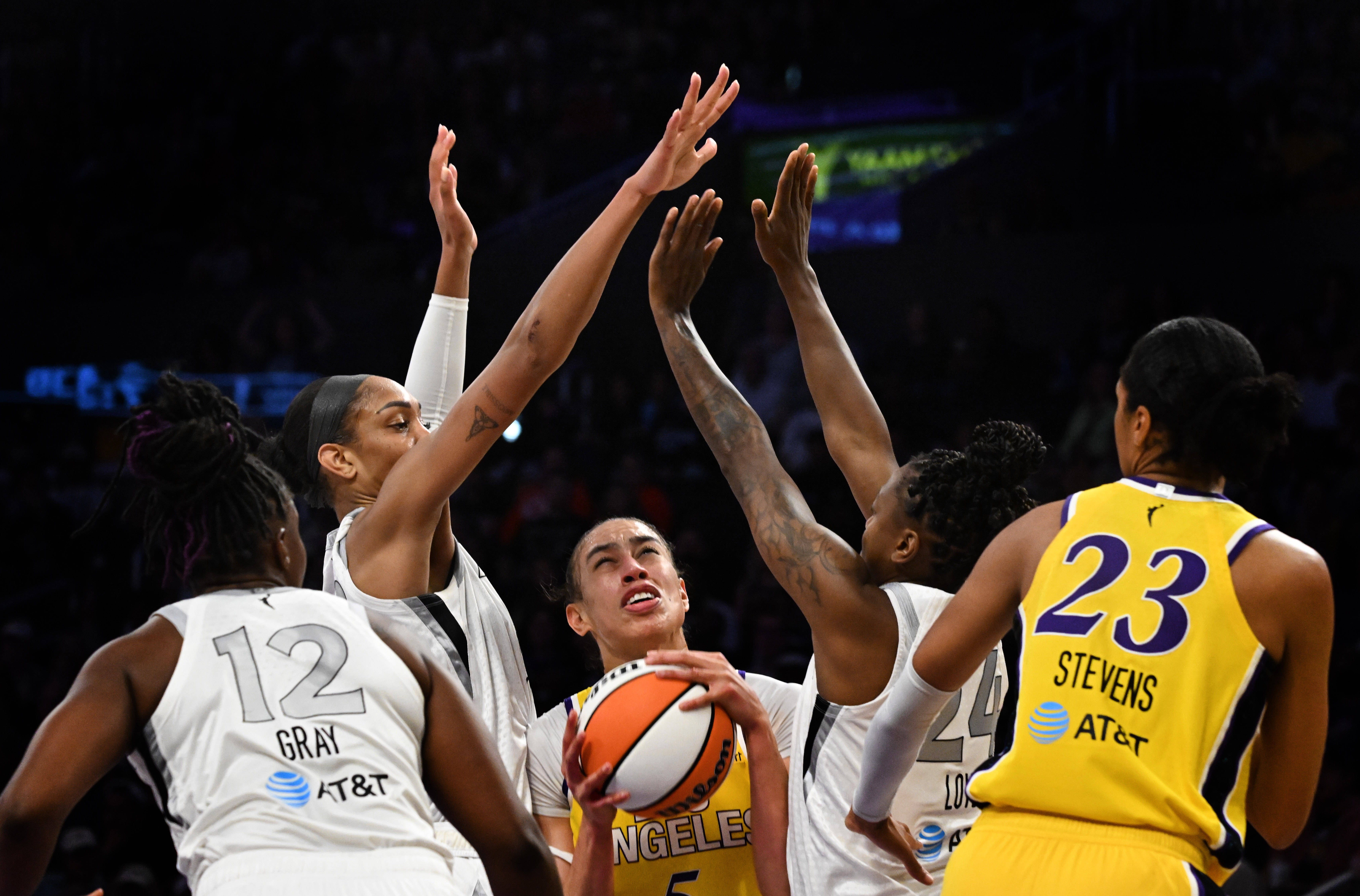 Sparks forward Dearica Hamby looks to shoot in traffic as...