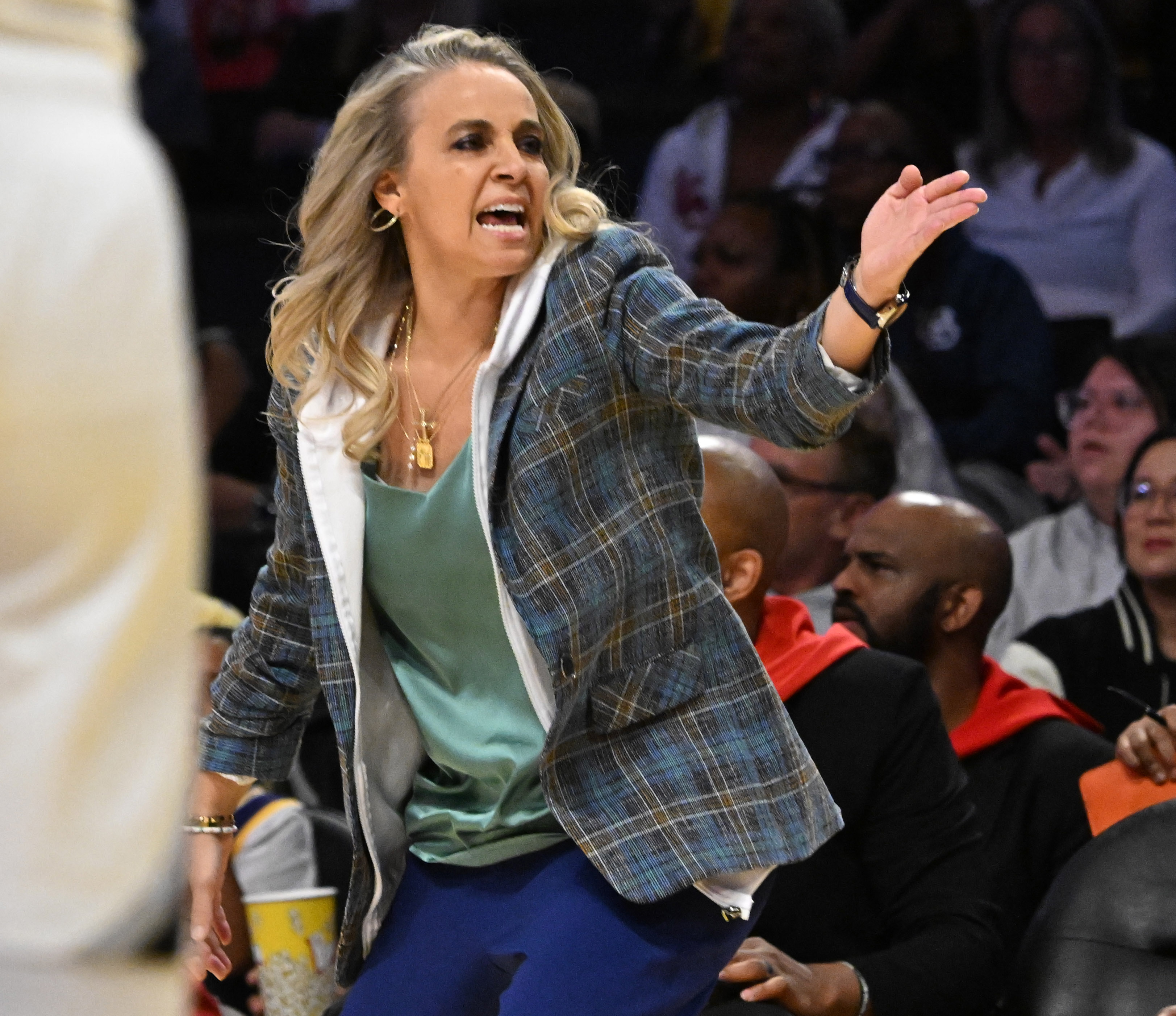 Las Vegas Aces head coach Becky Hammon reacts on the...