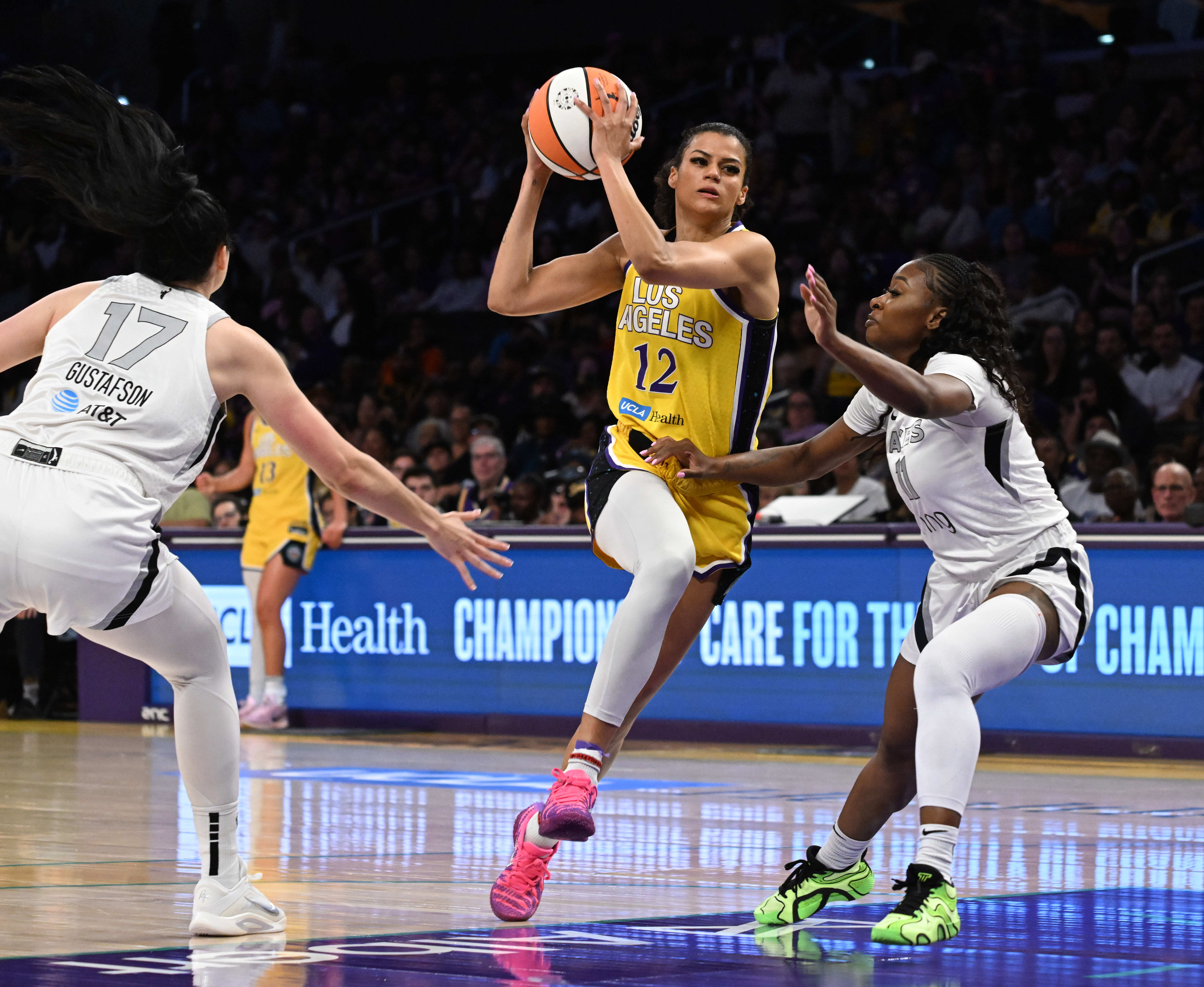 Sparks guard Rae Burrell drives to the basket as Las...