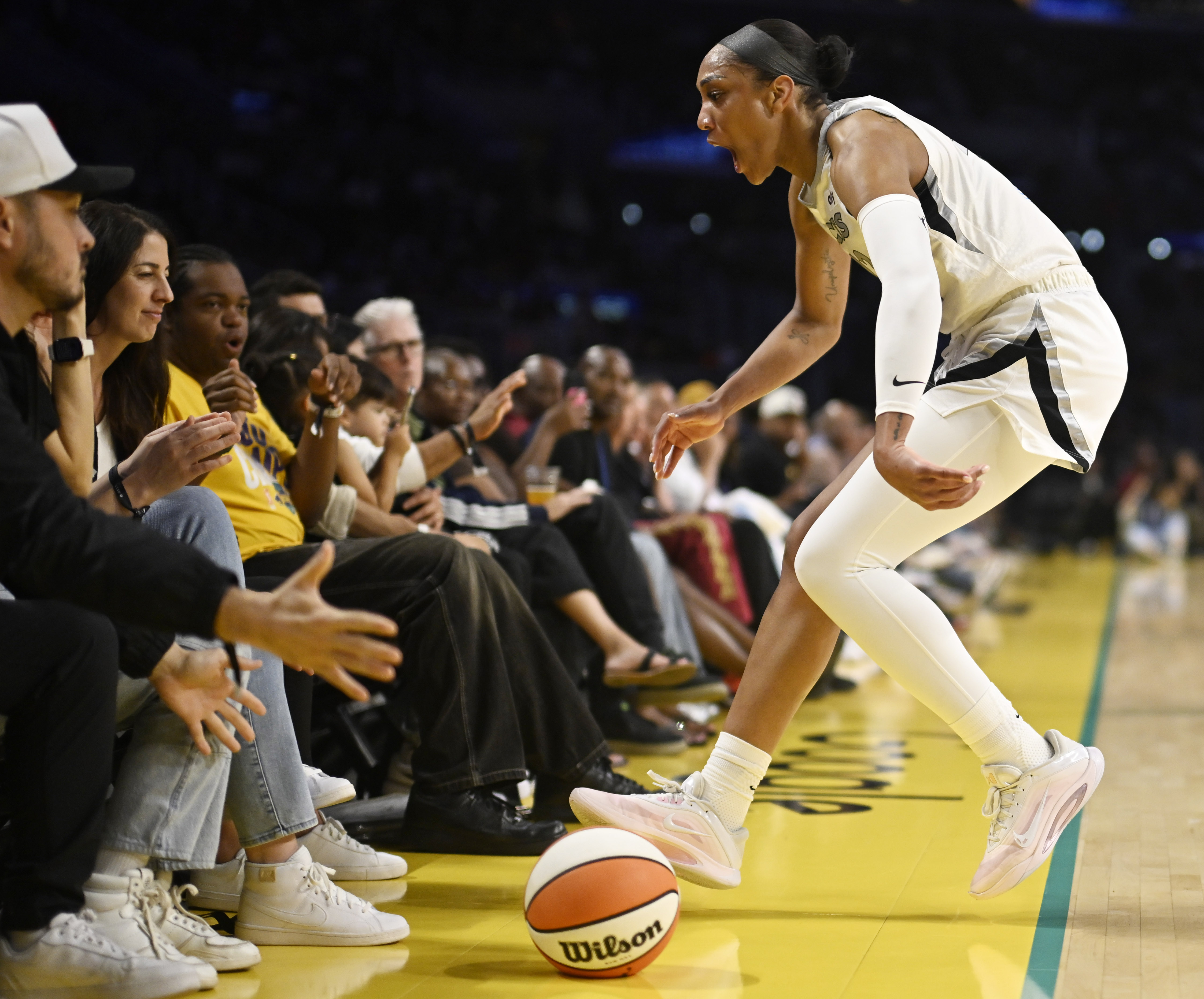 Las Vegas Aces center A’ja Wilson runs out of bounds...