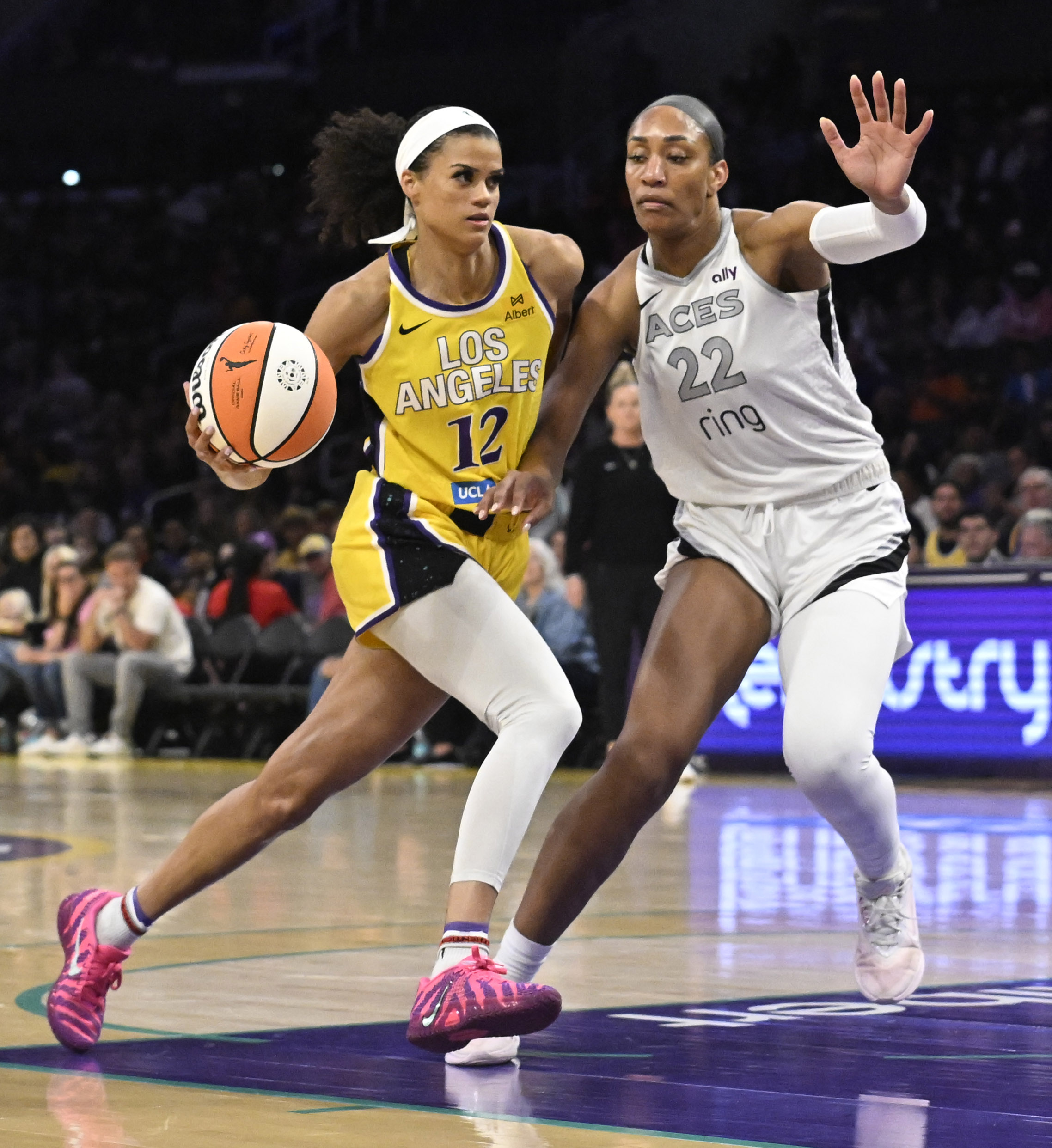 Sparks guard Rae Burrell drives to the basket as Las...