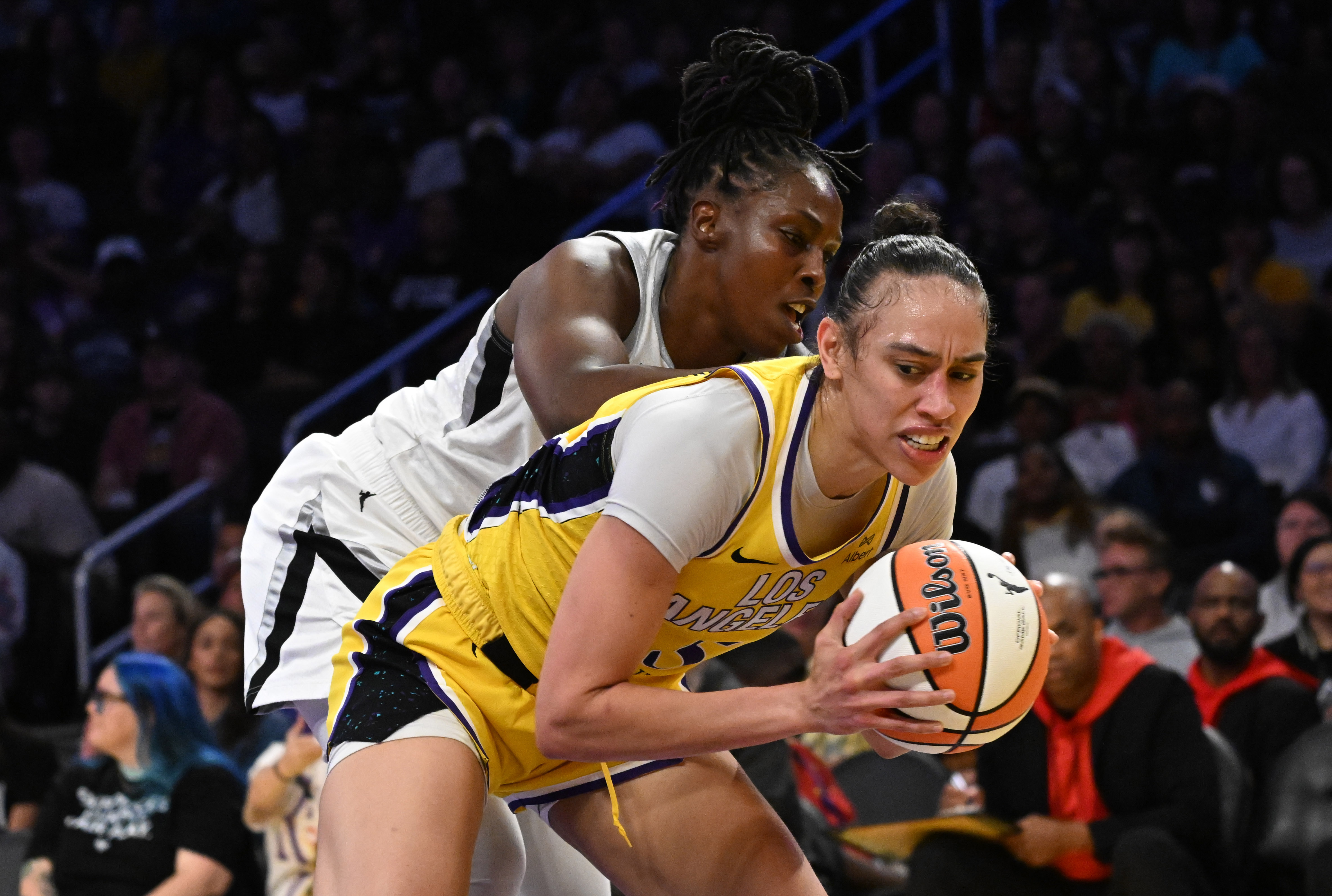 Sparks forward Dearica Hamby, front, is fouled by Las Vegas...