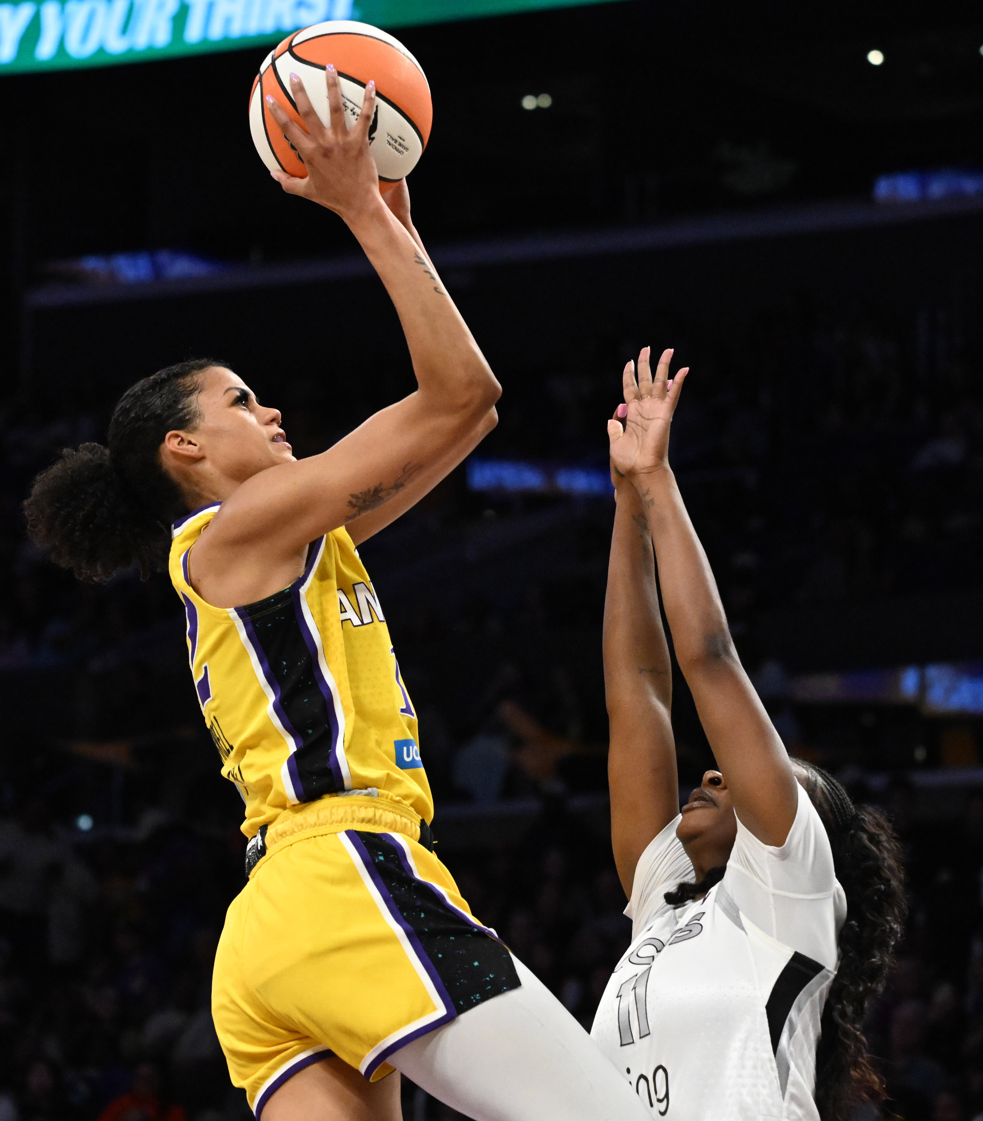 Sparks guard Rae Burrell looks to shoot over Las Vegas...
