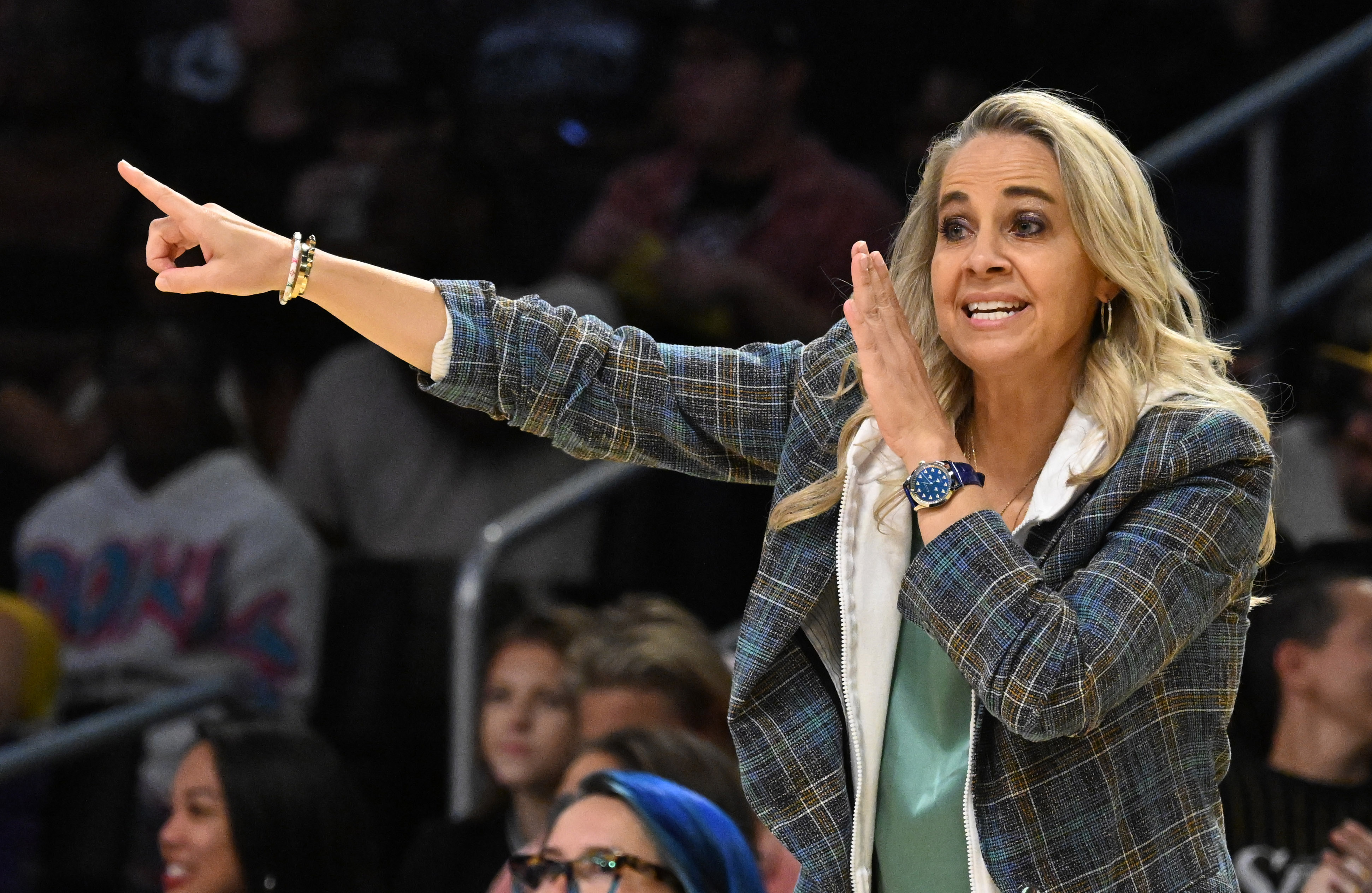 Las Vegas Aces head coach Becky Hammon yells instructions to...