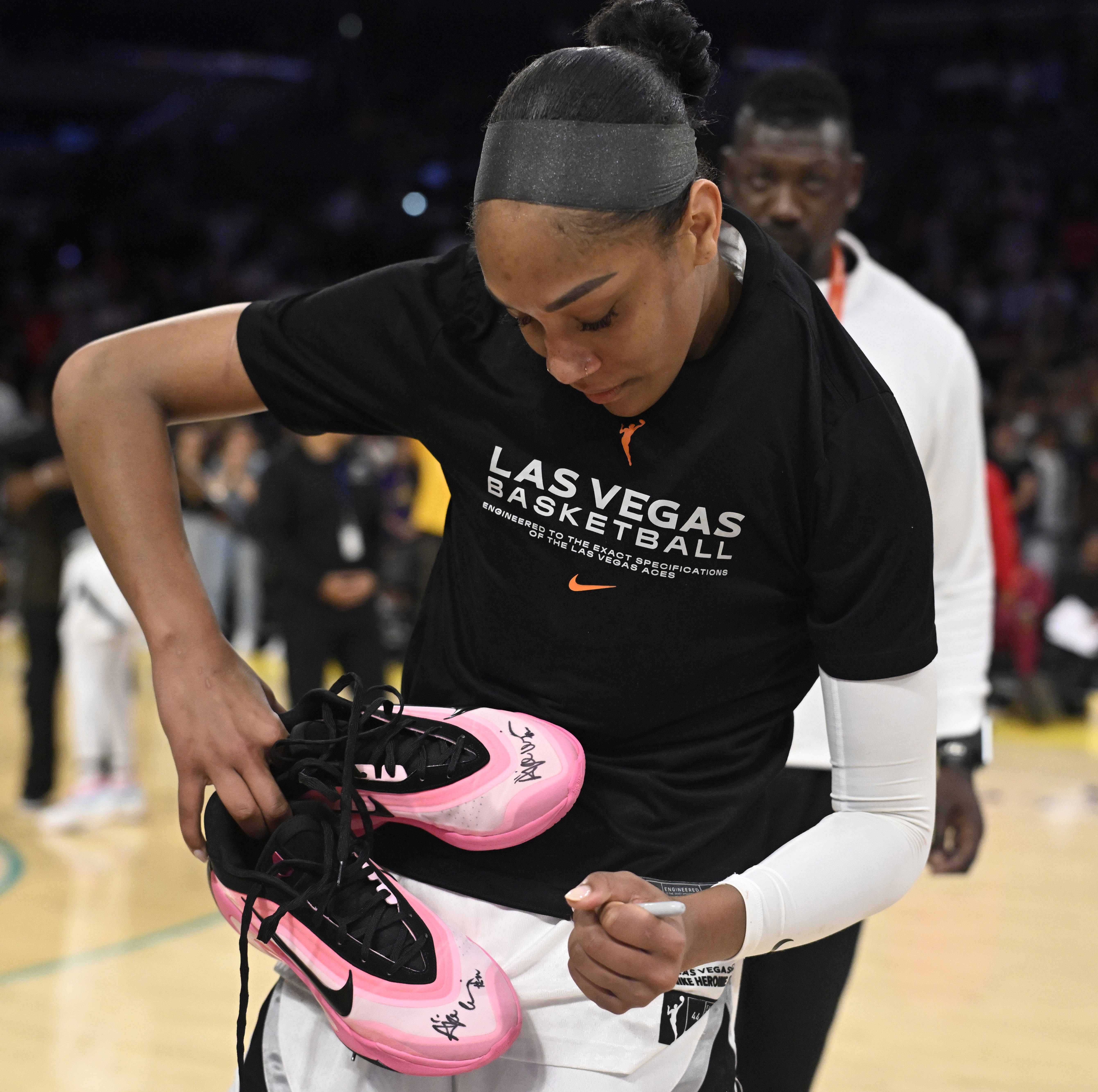 Las Vegas Aces center A’ja Wilson signs shoes for Sparks...