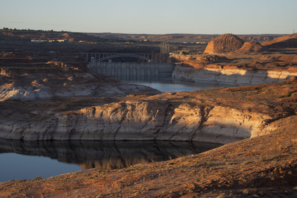 Early morning sunlight hits canyon walls on Lake Powell in Glen Canyon National Recreation Area on July 10, 2025 in Page, Arizona. Lake Powell, a critical Colorado River reservoir, is only at a third of its capacity as drought conditions in the Southwest worsen. Credit: Rebecca Noble via Getty Images