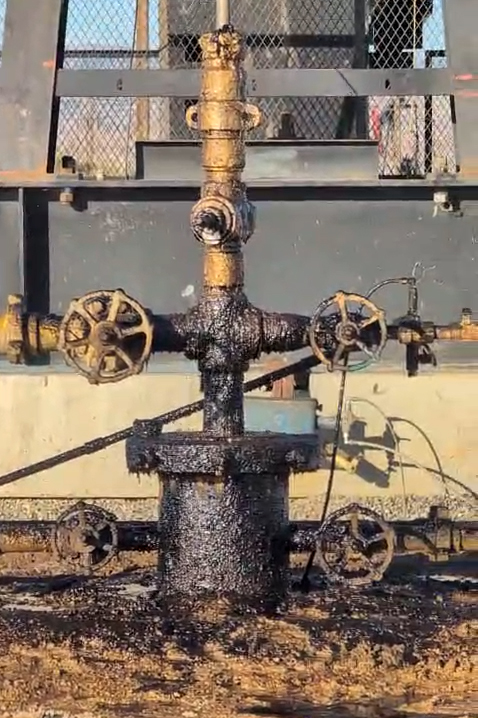An oil well near the Kern County town of Lost Hills created large puddles as it spilled hydrocarbons onto the ground in September. Credit: Cesar Aguirre/CCEJN