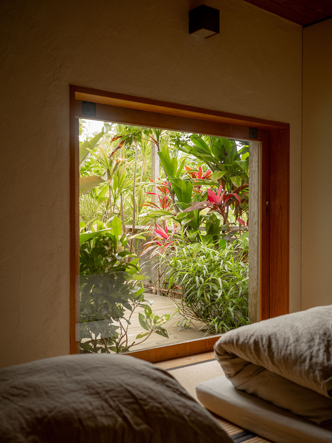 picture window in front of beds