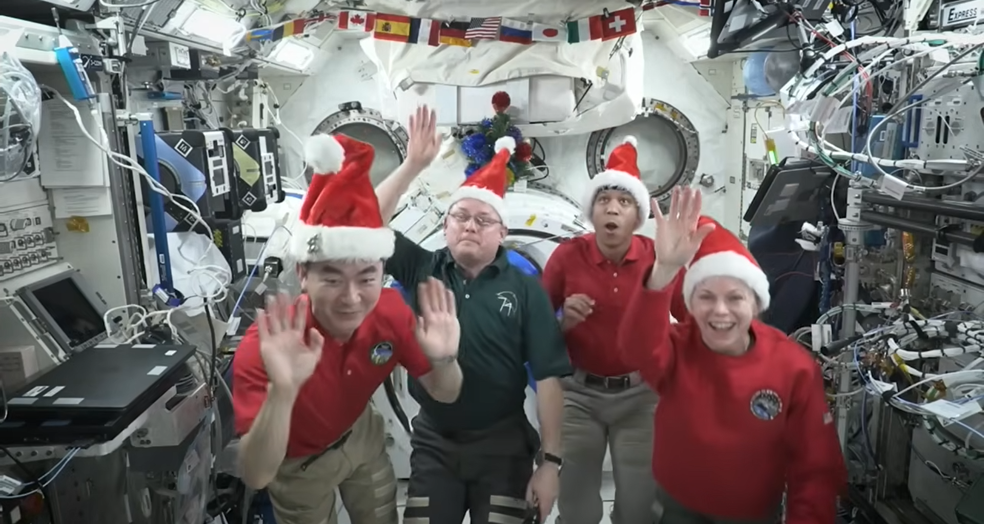 Astronauts beam home Christmas wishes from International Space Station: 'I think we may be orbiting a little higher than Santa' (video)