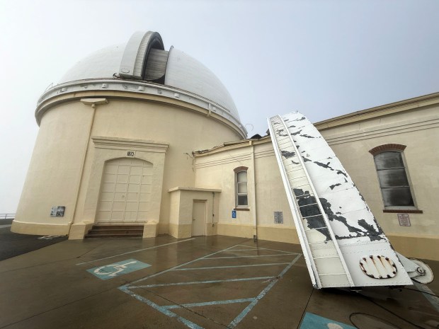 The Christmas Day storm that brought winds of 110 mph to the top of Mt Hamilton where the James Lick Observatory sits brought down the 60-foot crescent steel door that once covered half the dome's vertical opening. The door landed onto an adjoining building where it broke windows and splintered attic beams.  (Photo by Jamey Eriksen/UCSC Lick Observatory)