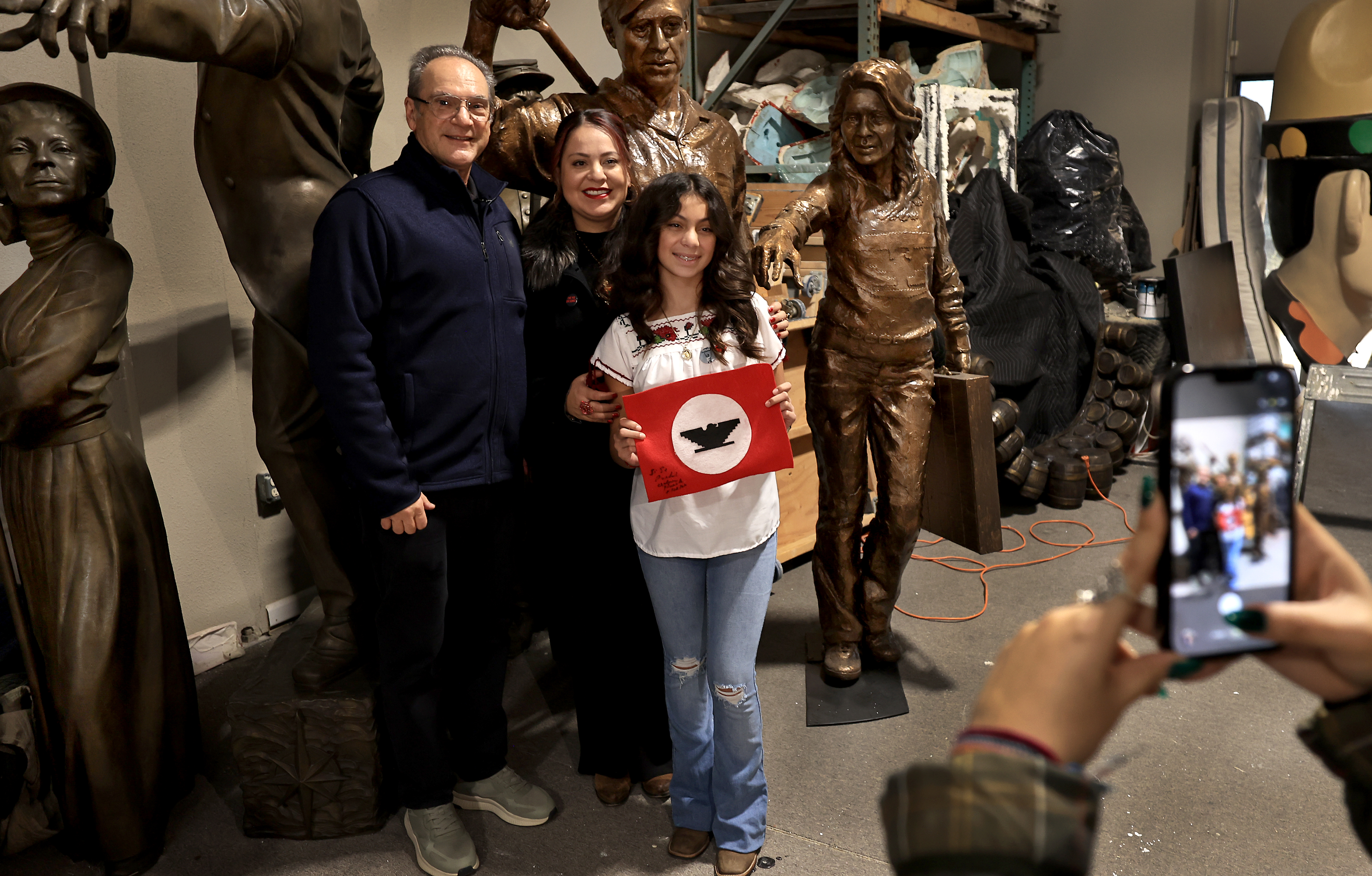 Artist Mario Chiodo, left, has his photograph made with Mia...