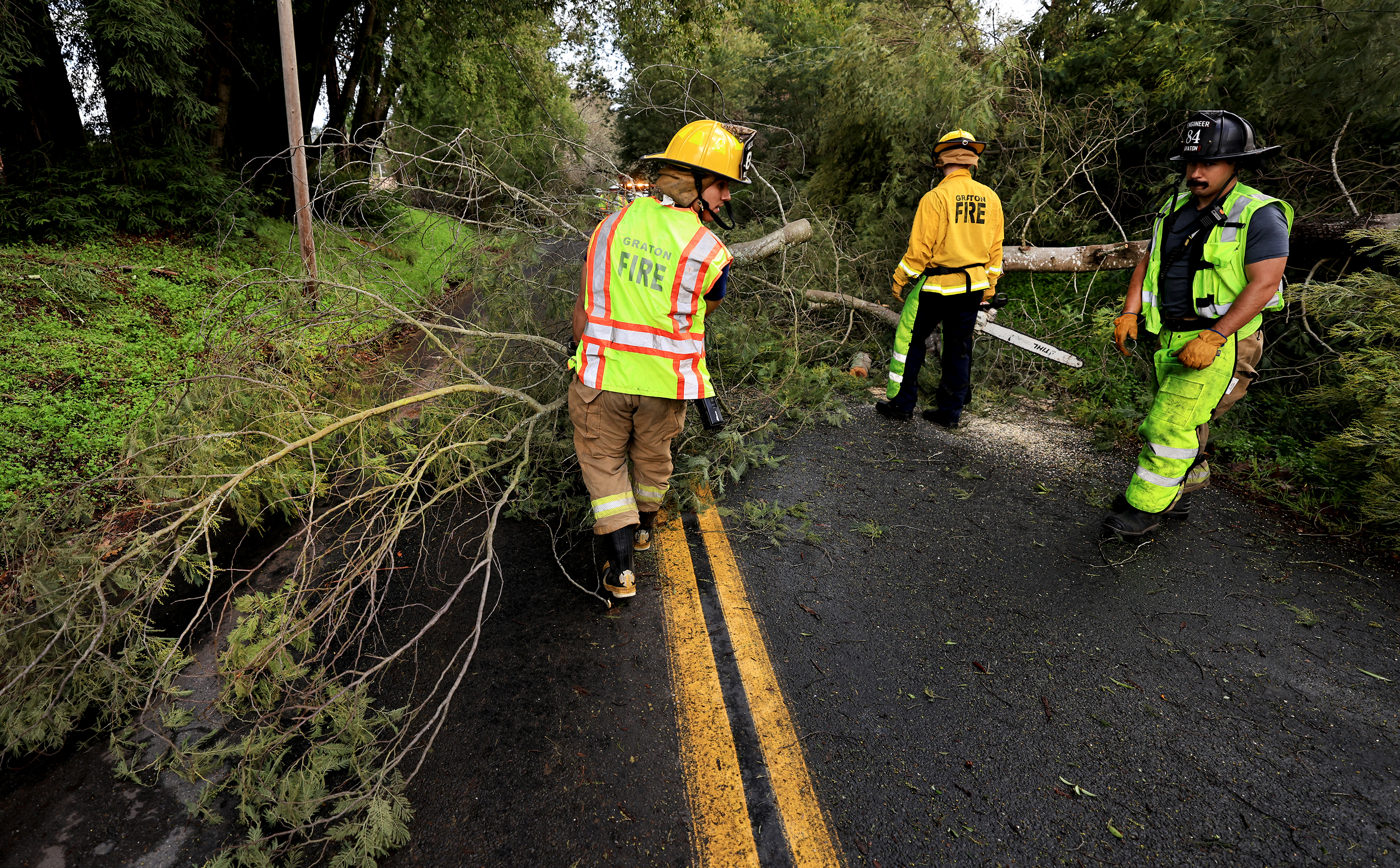 Graton Fire Protection District firefighters, including volunteer Shane Skikos, left,...