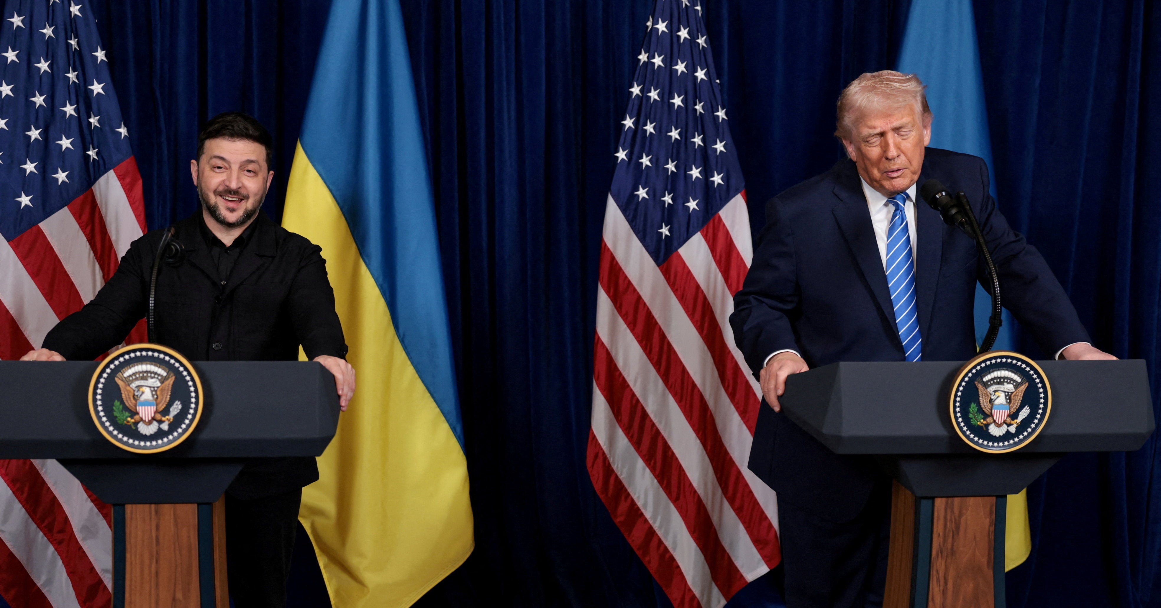 Ukrainian president Volodymyr Zelensky smiles after US president Donald Trump said that Russian president Vladimir Putin expressed willingness to help Ukraine 'succeed'