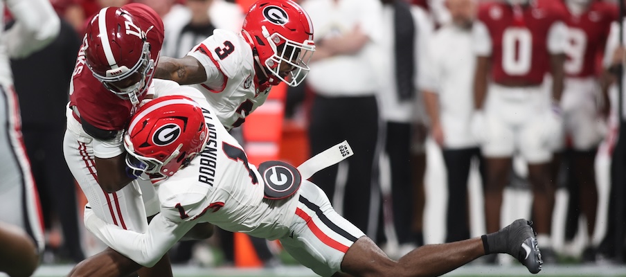 Georgia’s Ellis Robinson IV and CJ Allen making a tackle in the SEC Championship Game