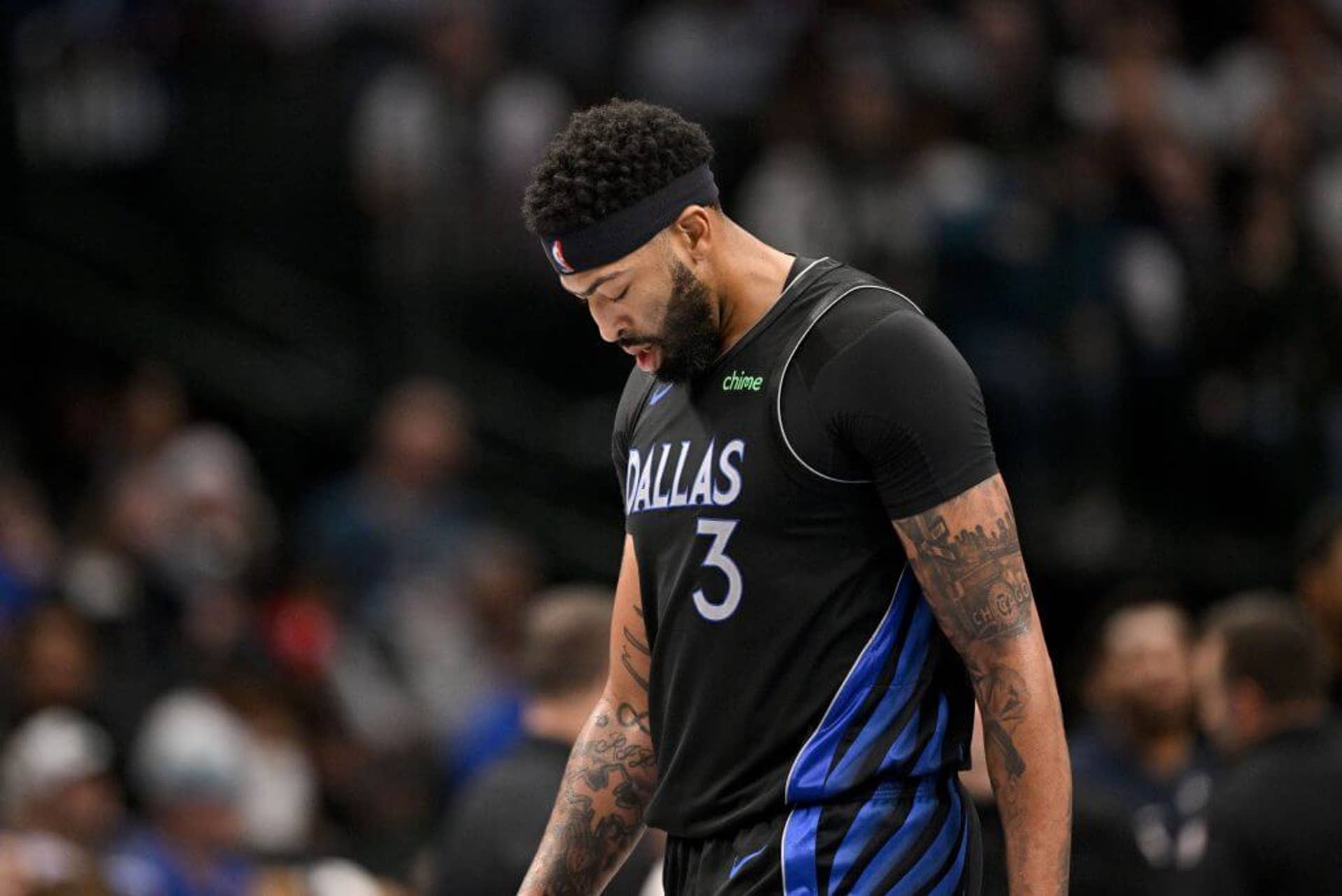 Dallas Mavericks forward Anthony Davis looks down during a game against the Nuggets.