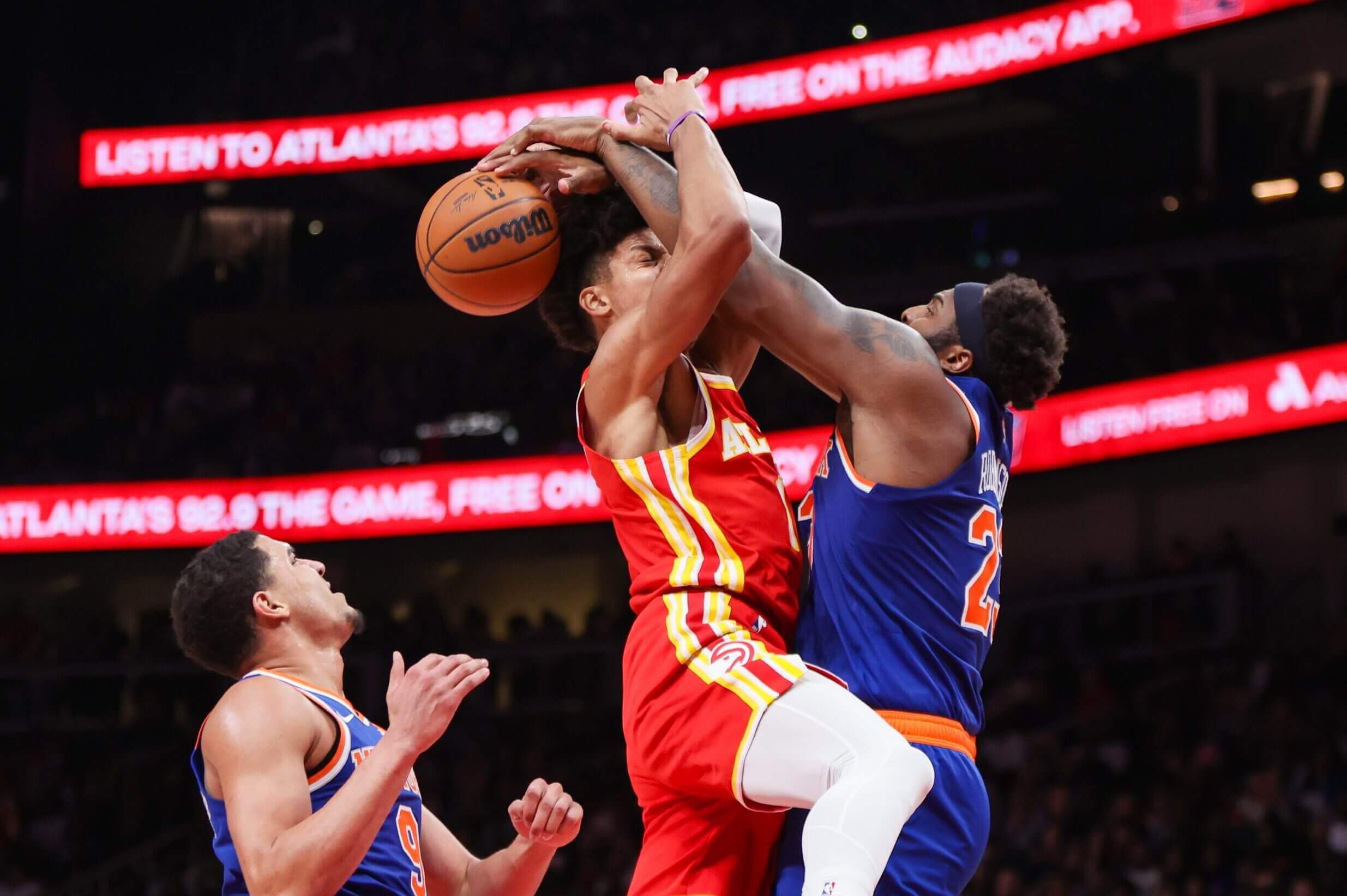Atlanta's Jalen Johnson runs into the Knicks' Mitchell Robinson.