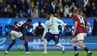 RIYADH, SAUDI ARABIA - DECEMBER 19: Yann Aurel Bisseck of Internazionale runs with the ball past Jhon Lucumi of Bologna FC 1909 during the Supercoppa Italiana semifinal match between Bologna FC 1909 and FC Internazionale at King Saud University Stadium on December 19, 2025 in Riyadh, Saudi Arabia. (Photo by Yasser Bakhsh/Getty Images)