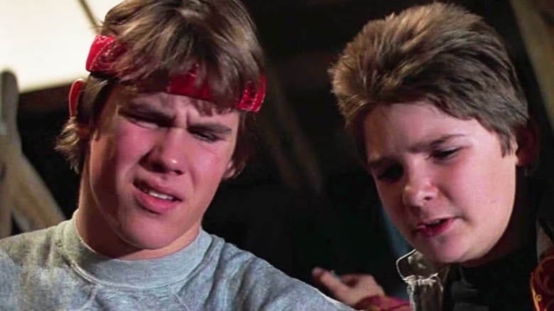Josh Brolin as Brand Walsh and Corey Feldman as Clark 