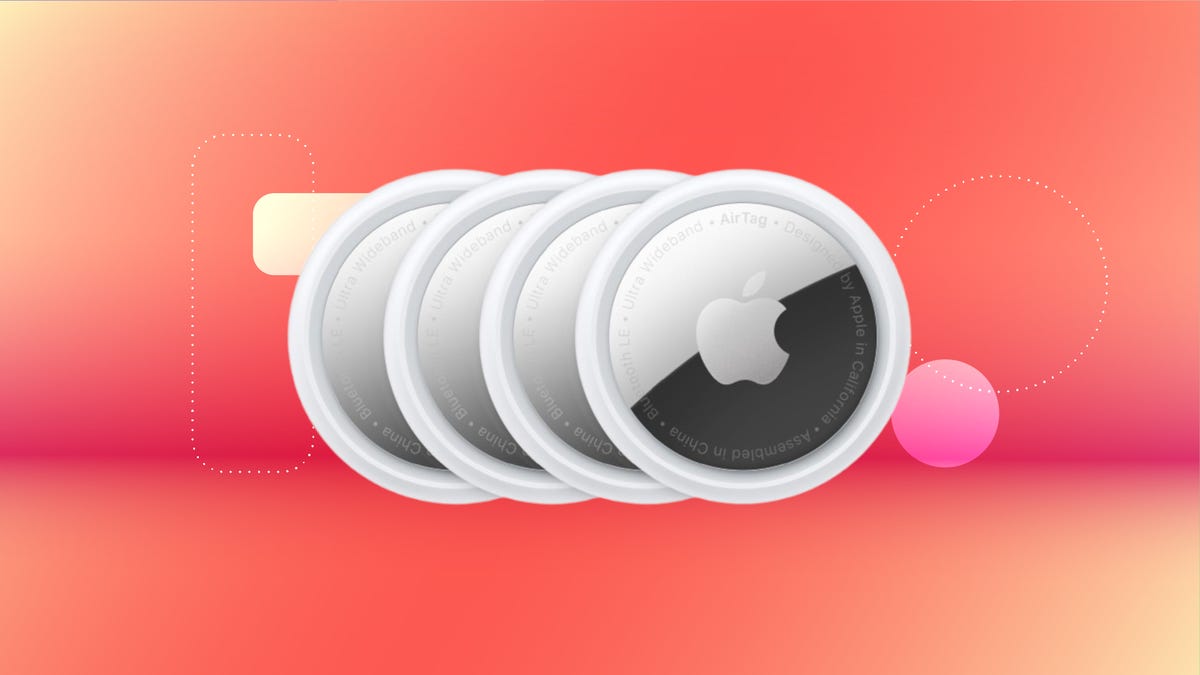 Shows four Apple AirTags on a red background.